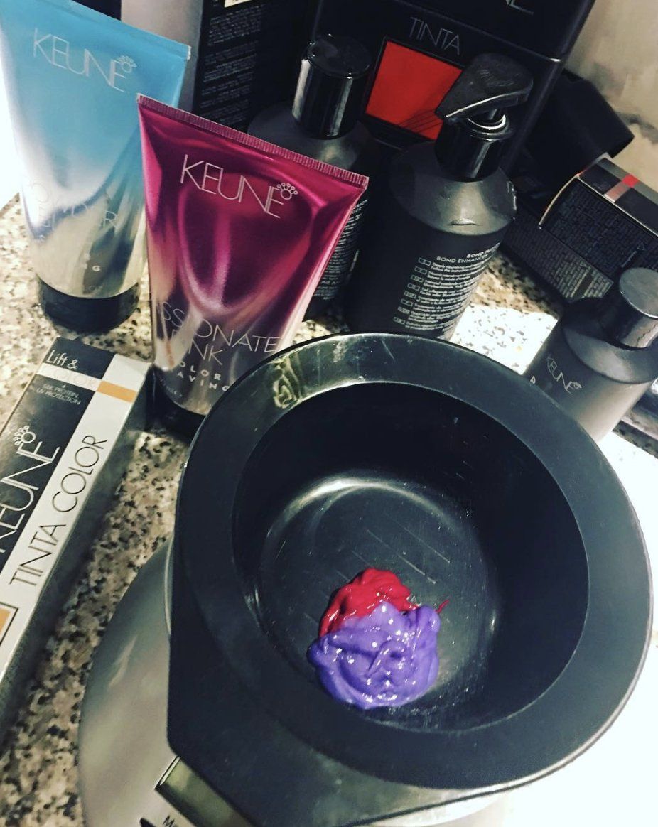 A bottle of keune hair color sits on a counter
