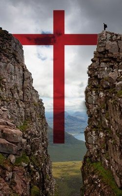 A red cross is painted on the side of a mountain.