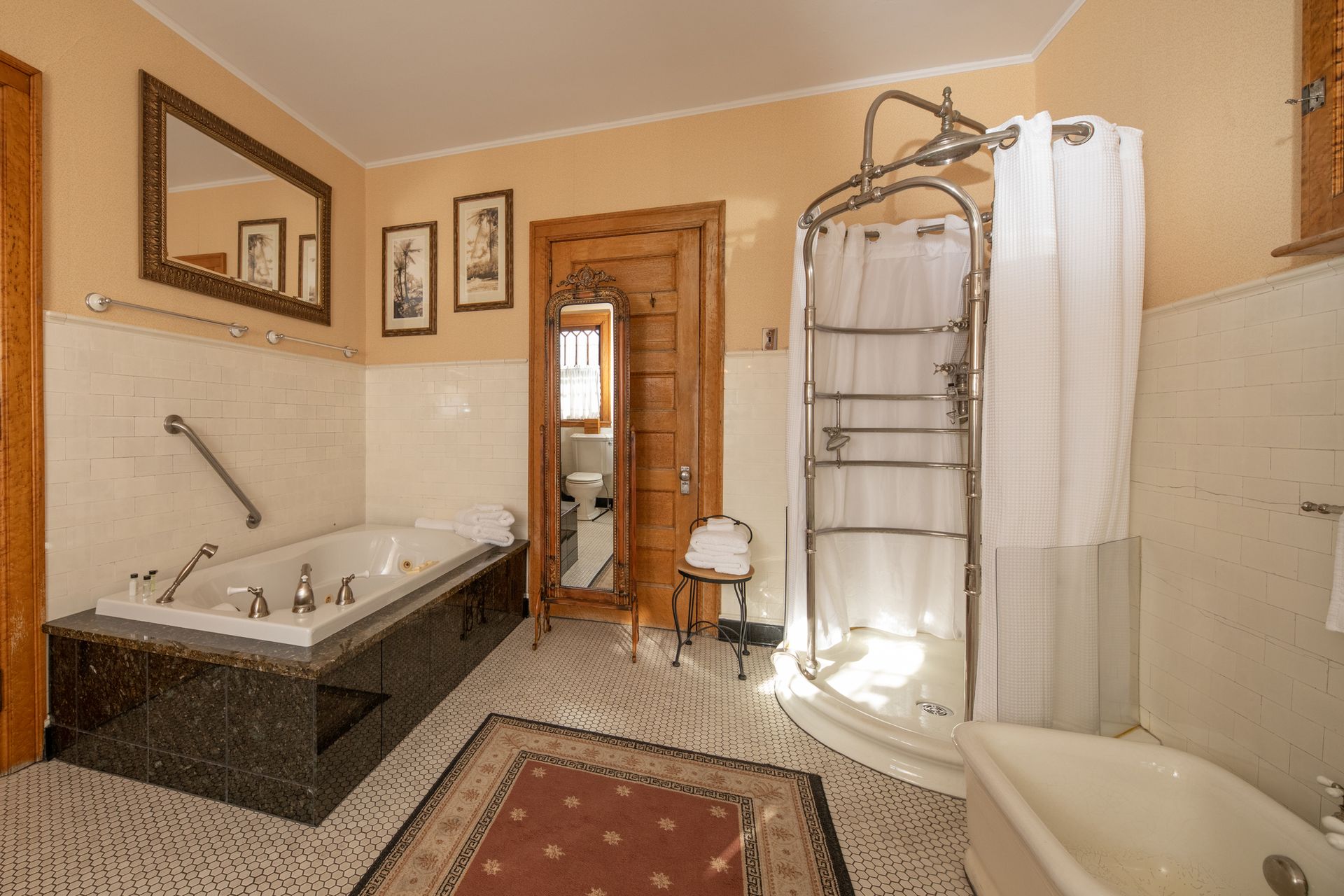 A bathroom with a tub , shower and mirror.