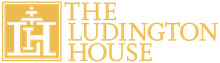 The logo for the ludington house is yellow and white.