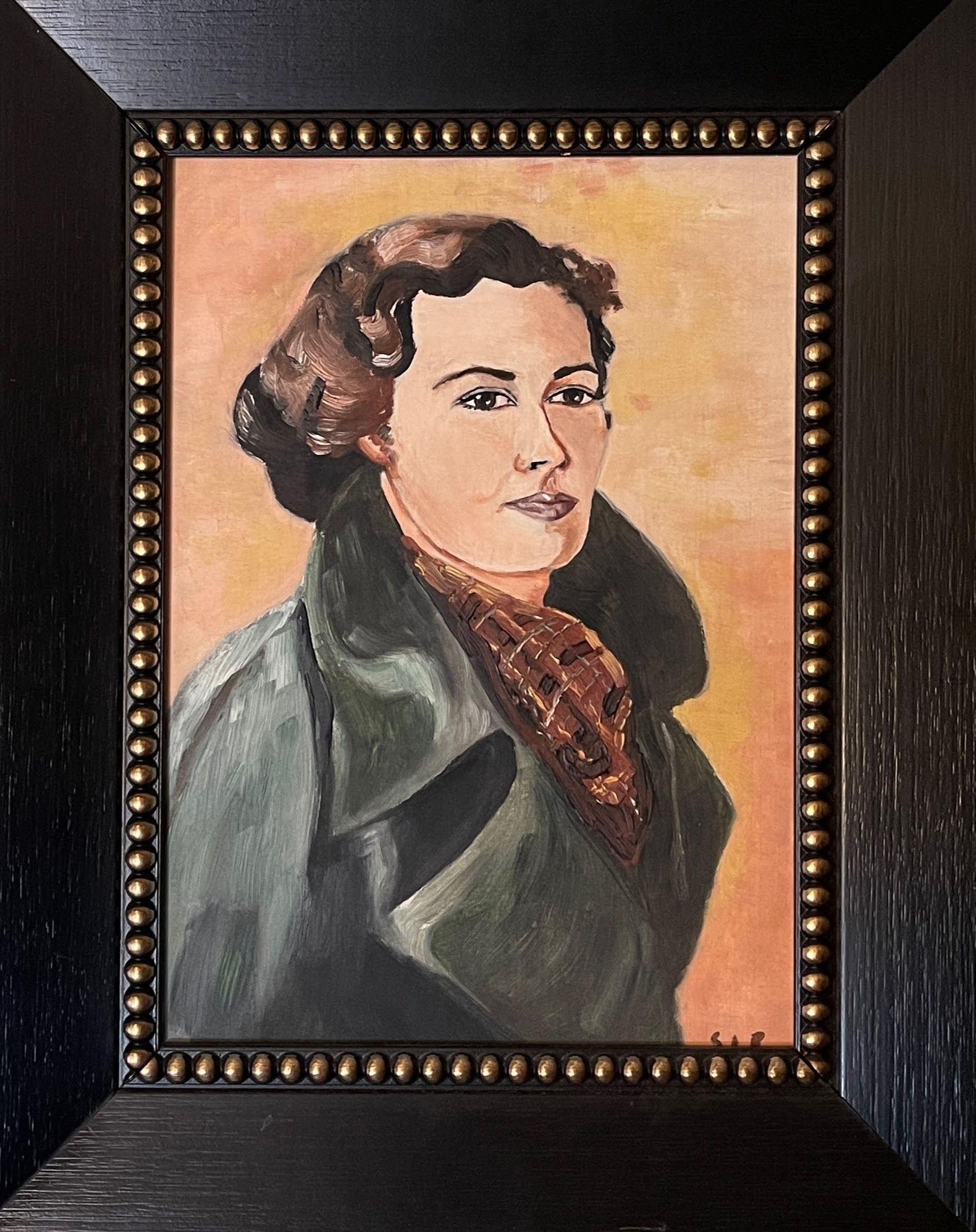 A framed painting of a woman in a green coat and scarf