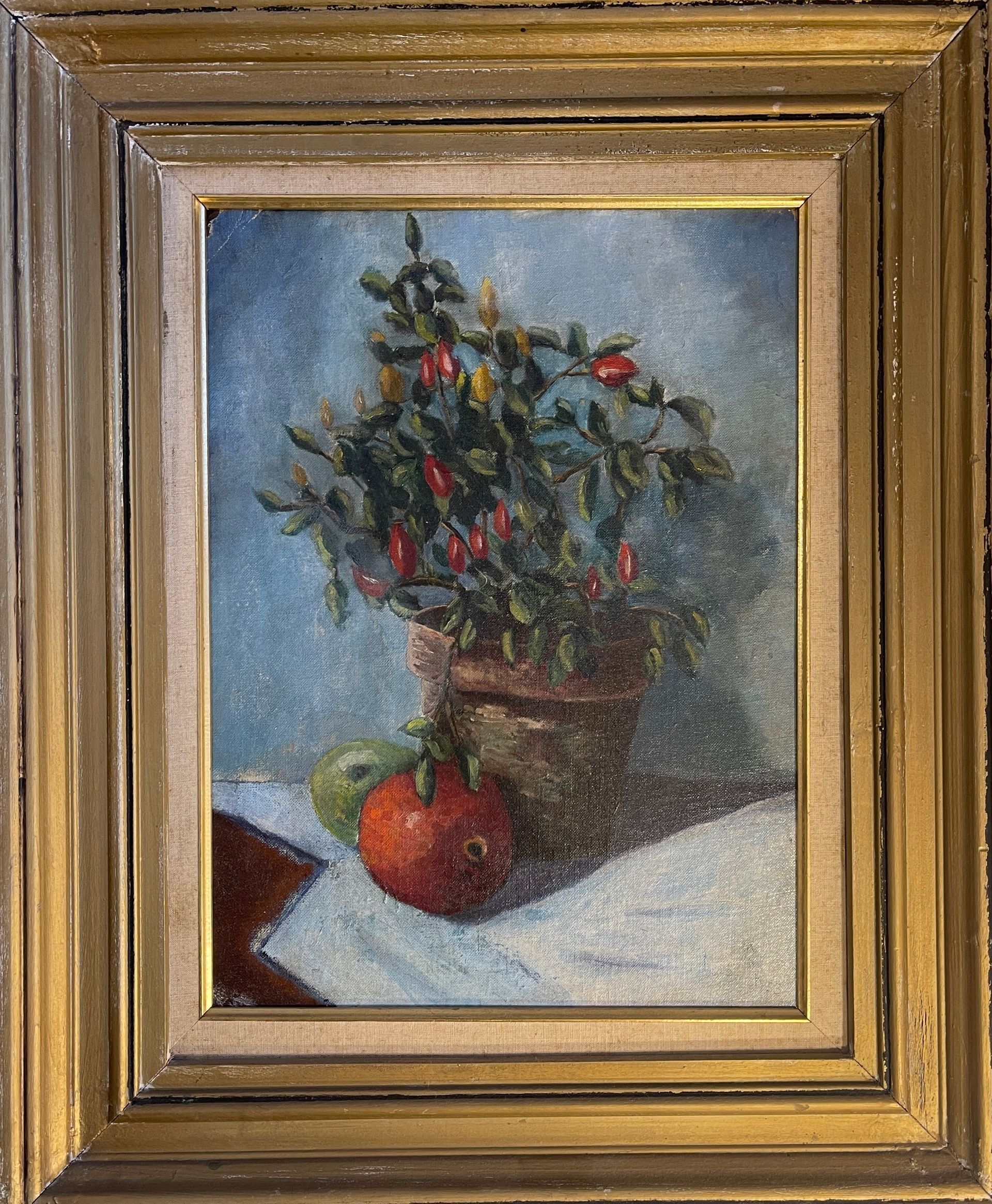 A painting of a plant and a pomegranate in a gold frame