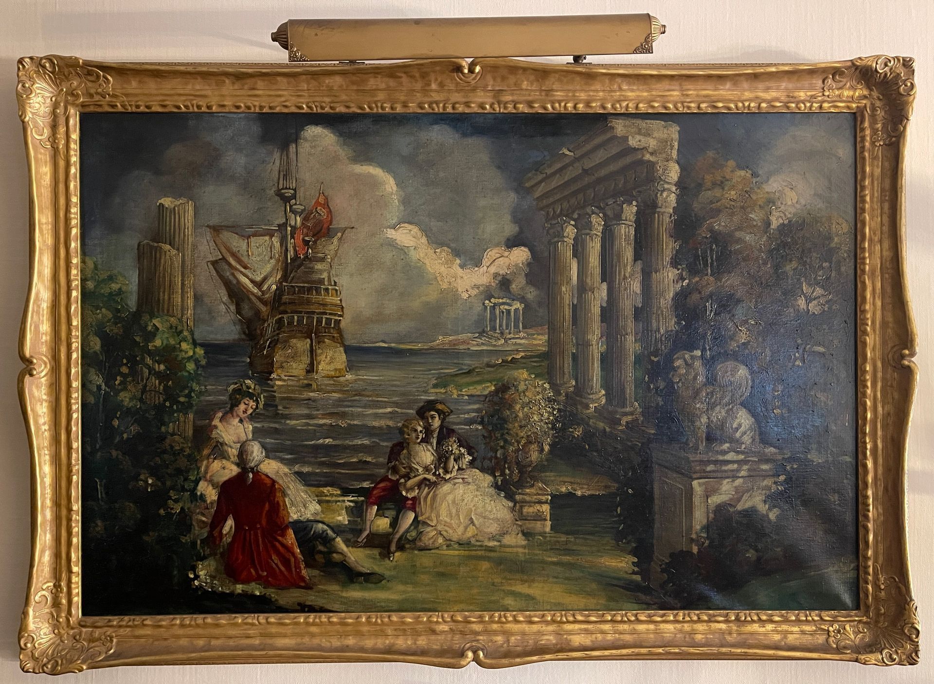 A painting in a gold frame hangs on a wall