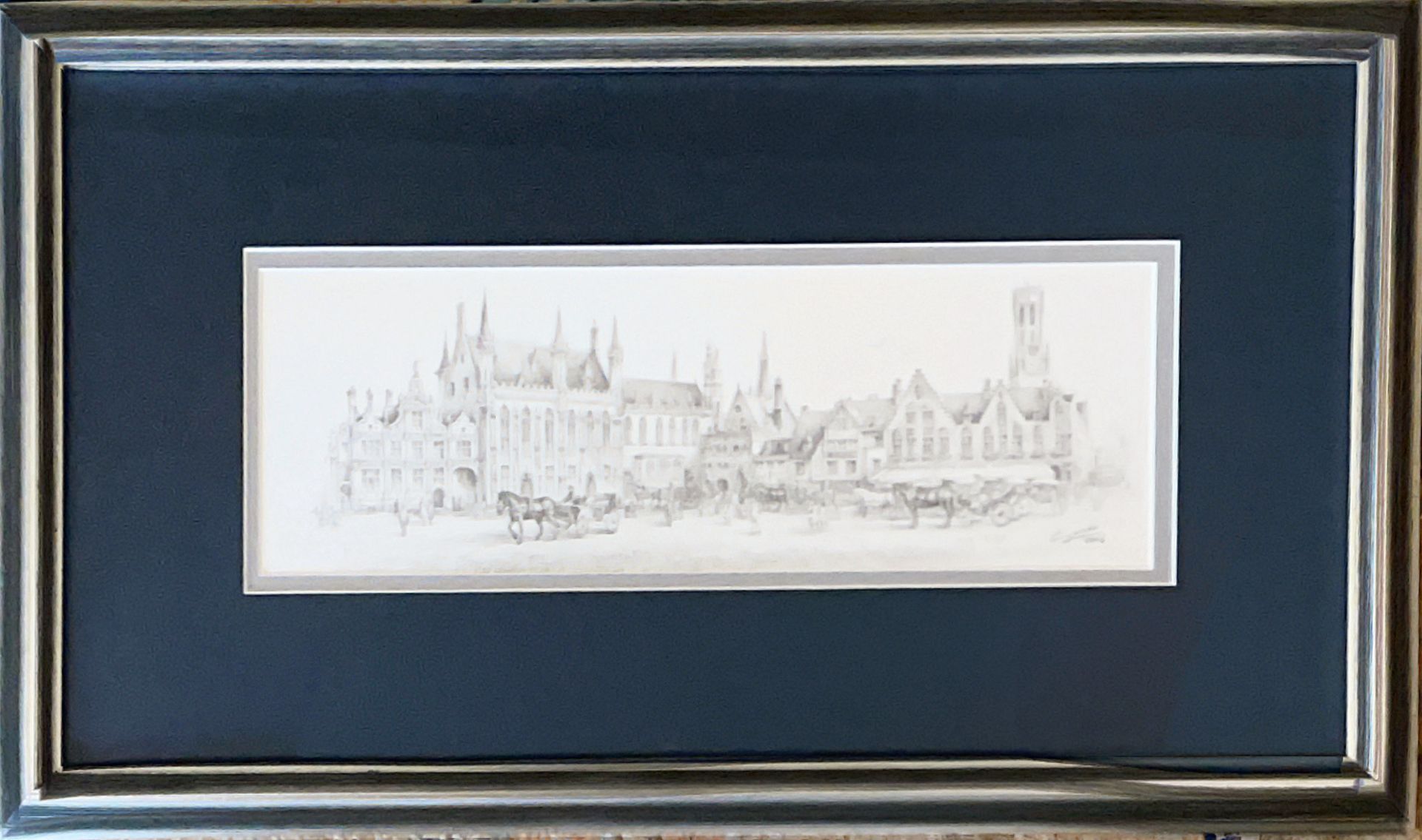 A drawing of a city in a blue frame