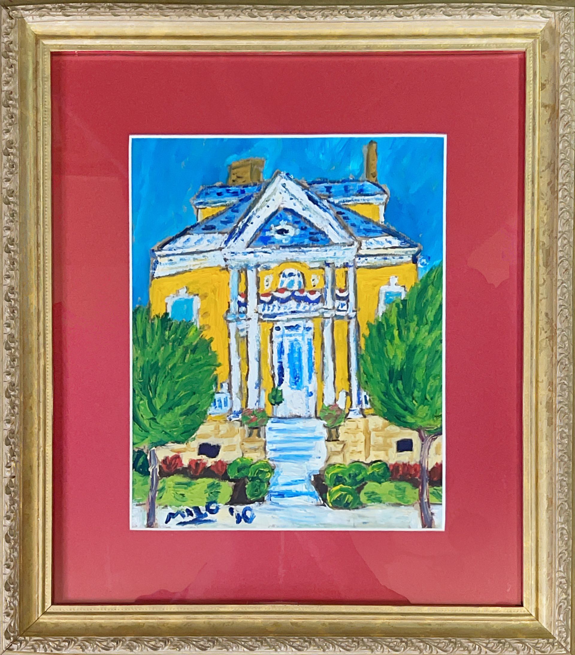 A framed painting of a yellow and blue house