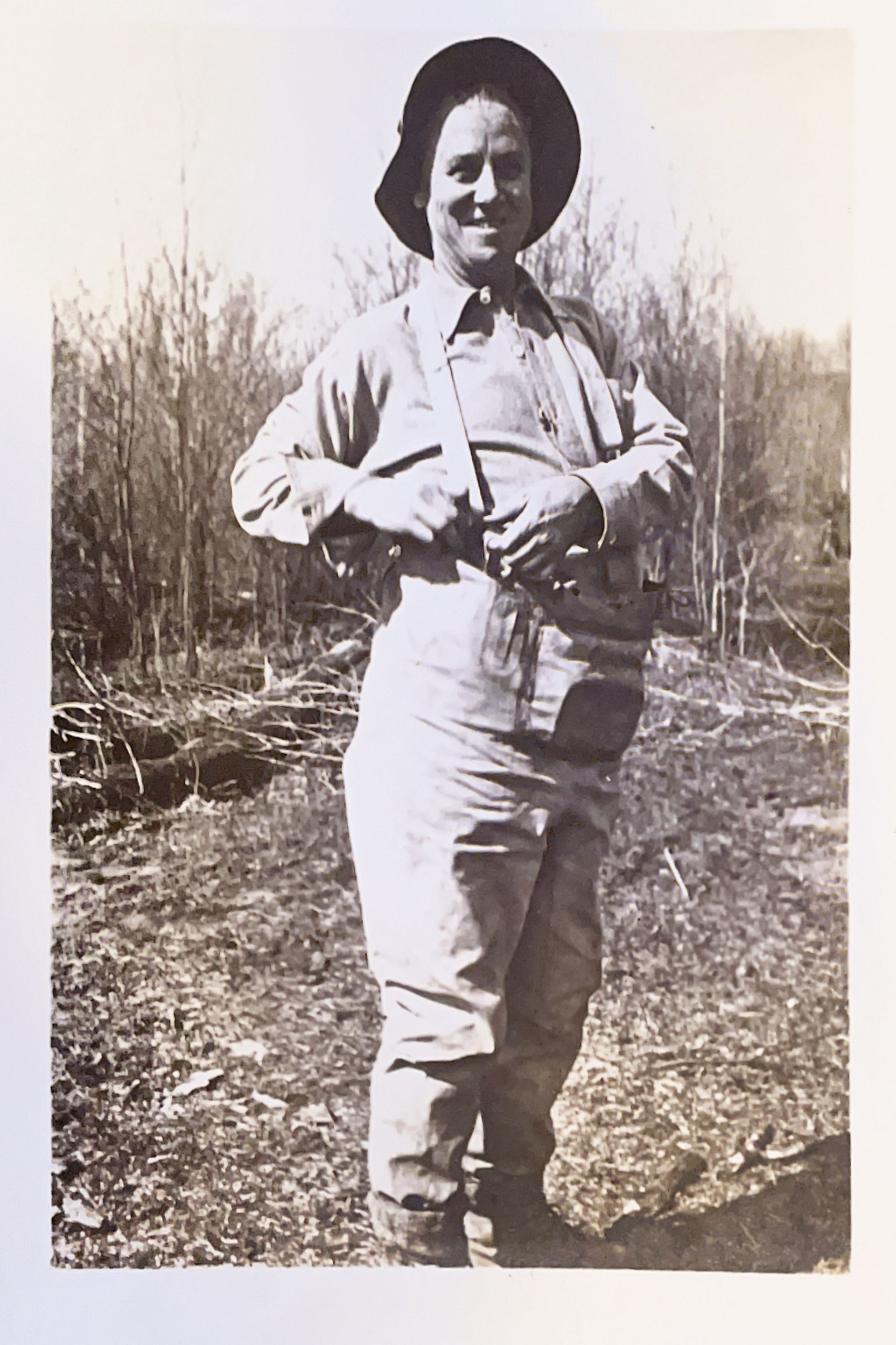 A black and white photo of a man in a cowboy hat