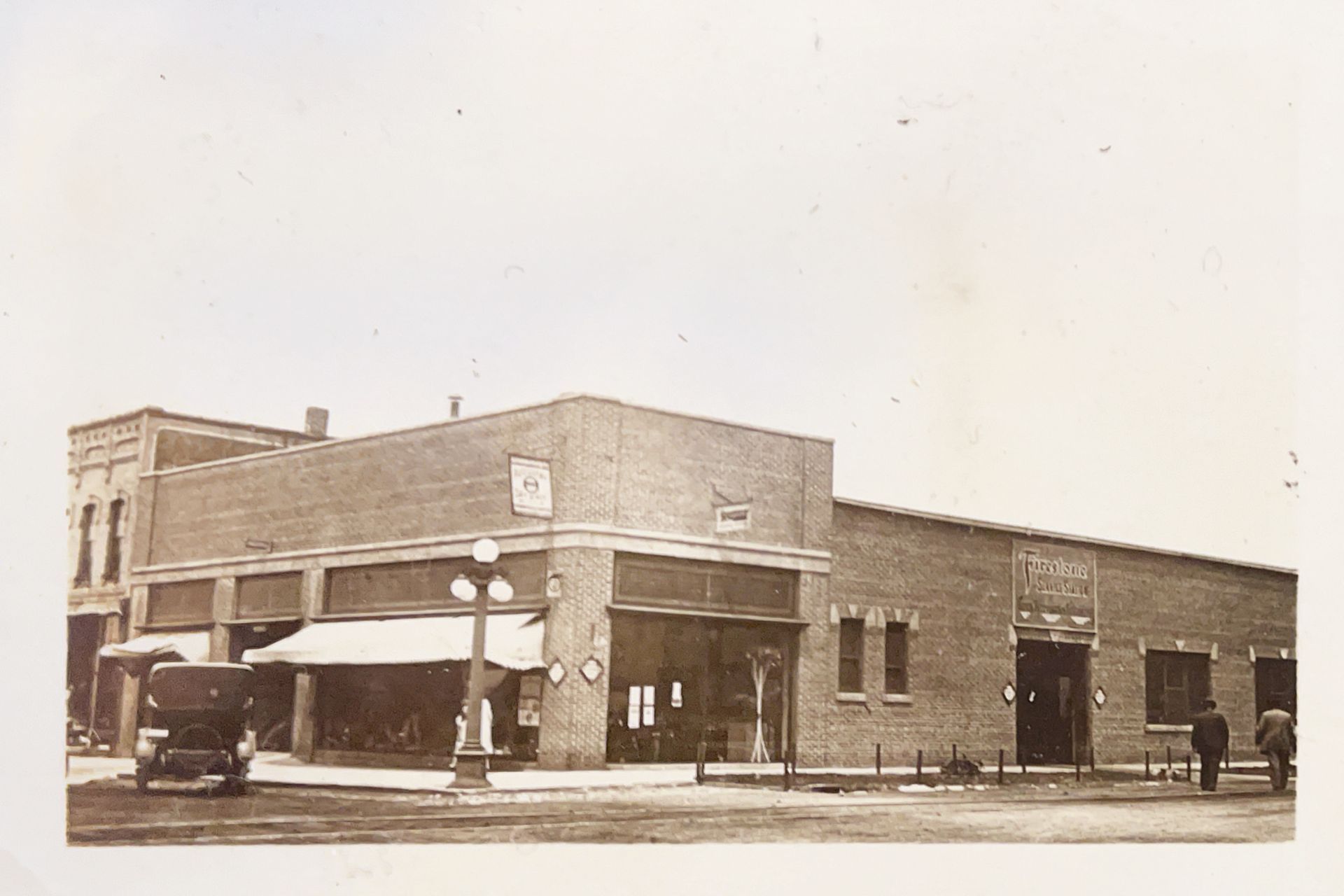 A black and white photo of a brick building