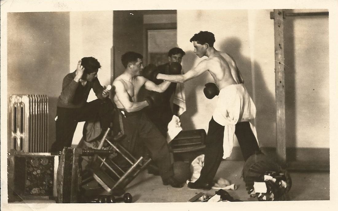 A black and white photo of a group of men