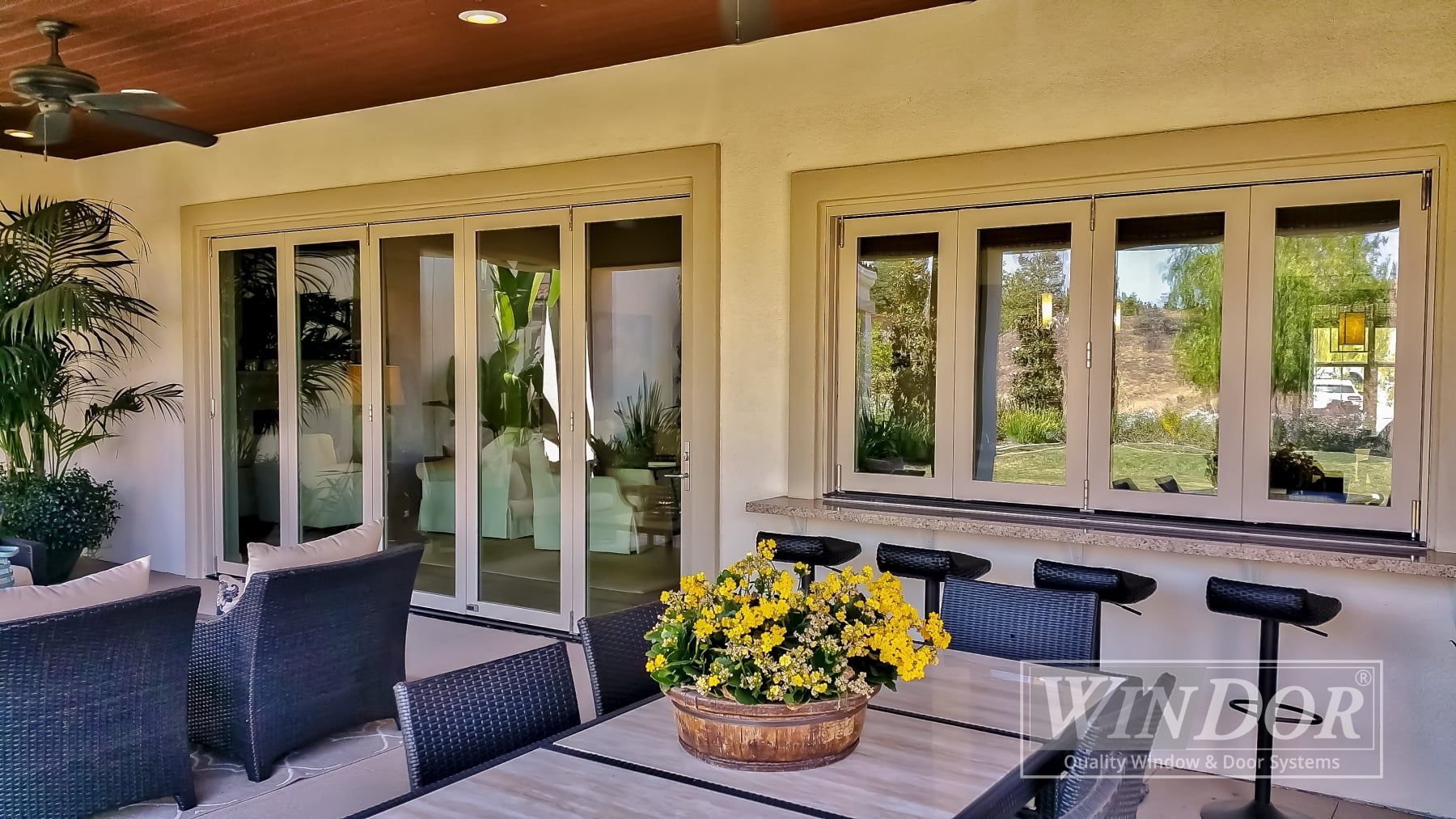 A living room with sliding glass doors leading to a patio.