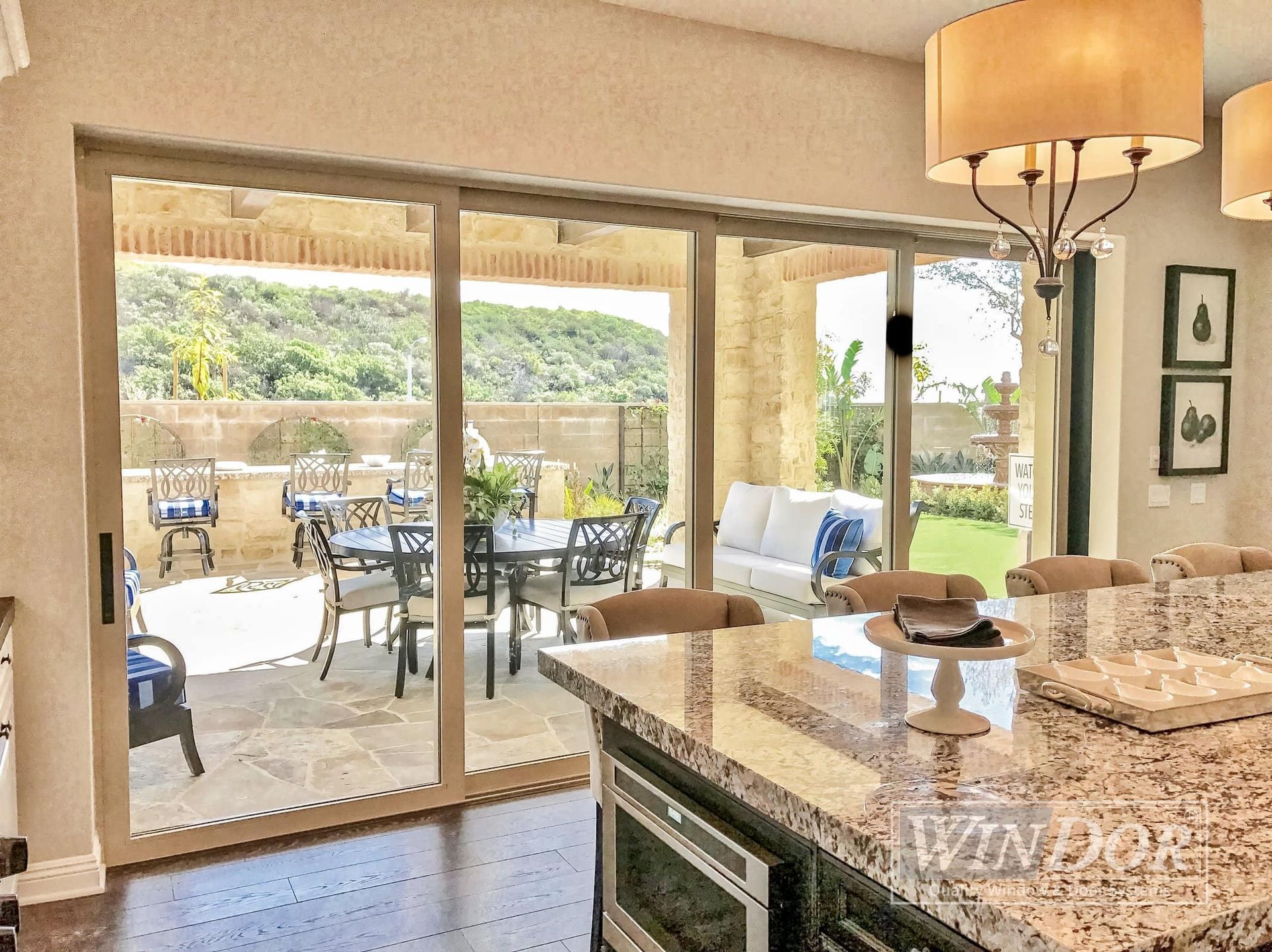 A kitchen with sliding glass doors leading to a patio