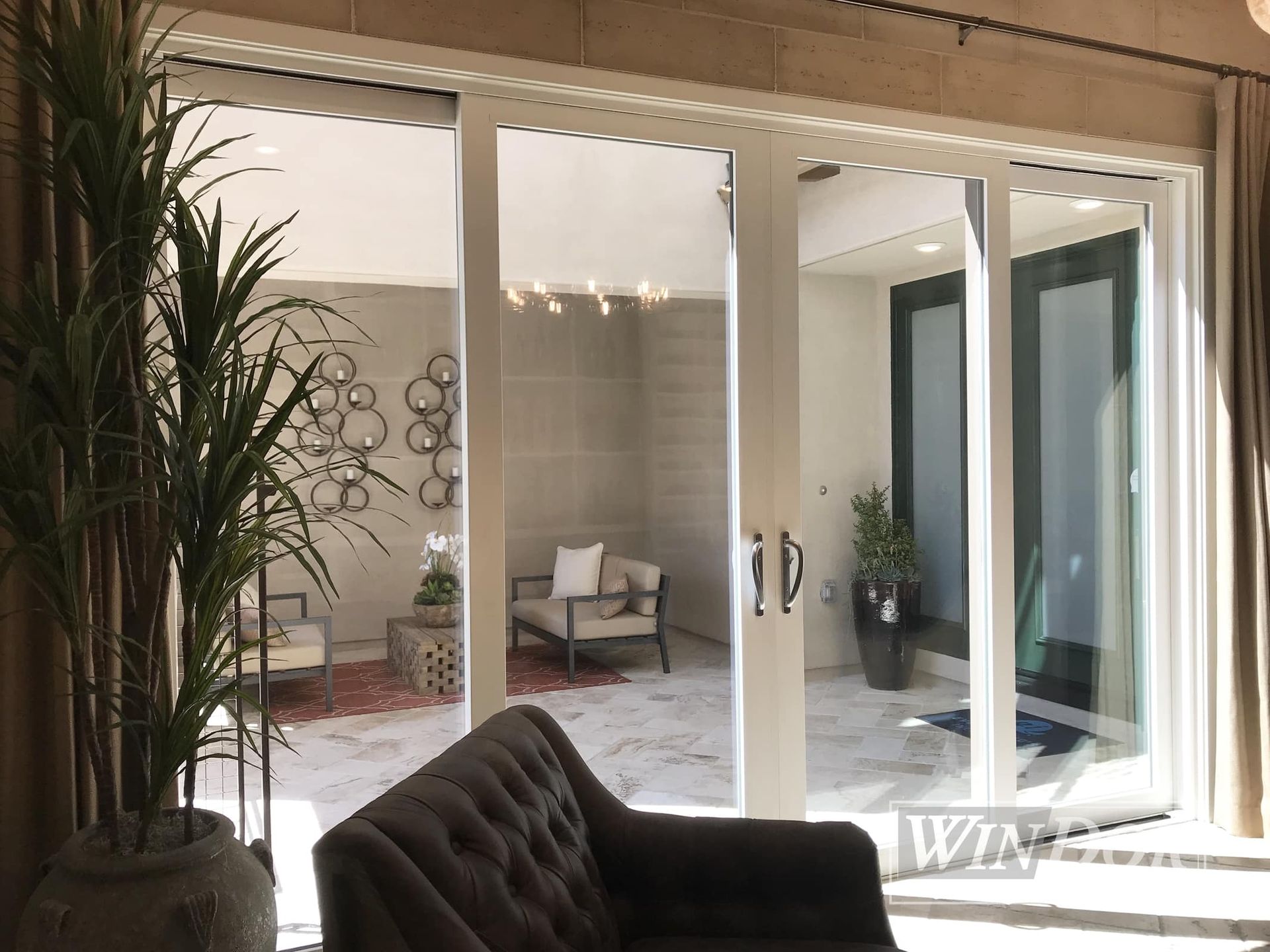 A living room with sliding glass doors leading to a patio