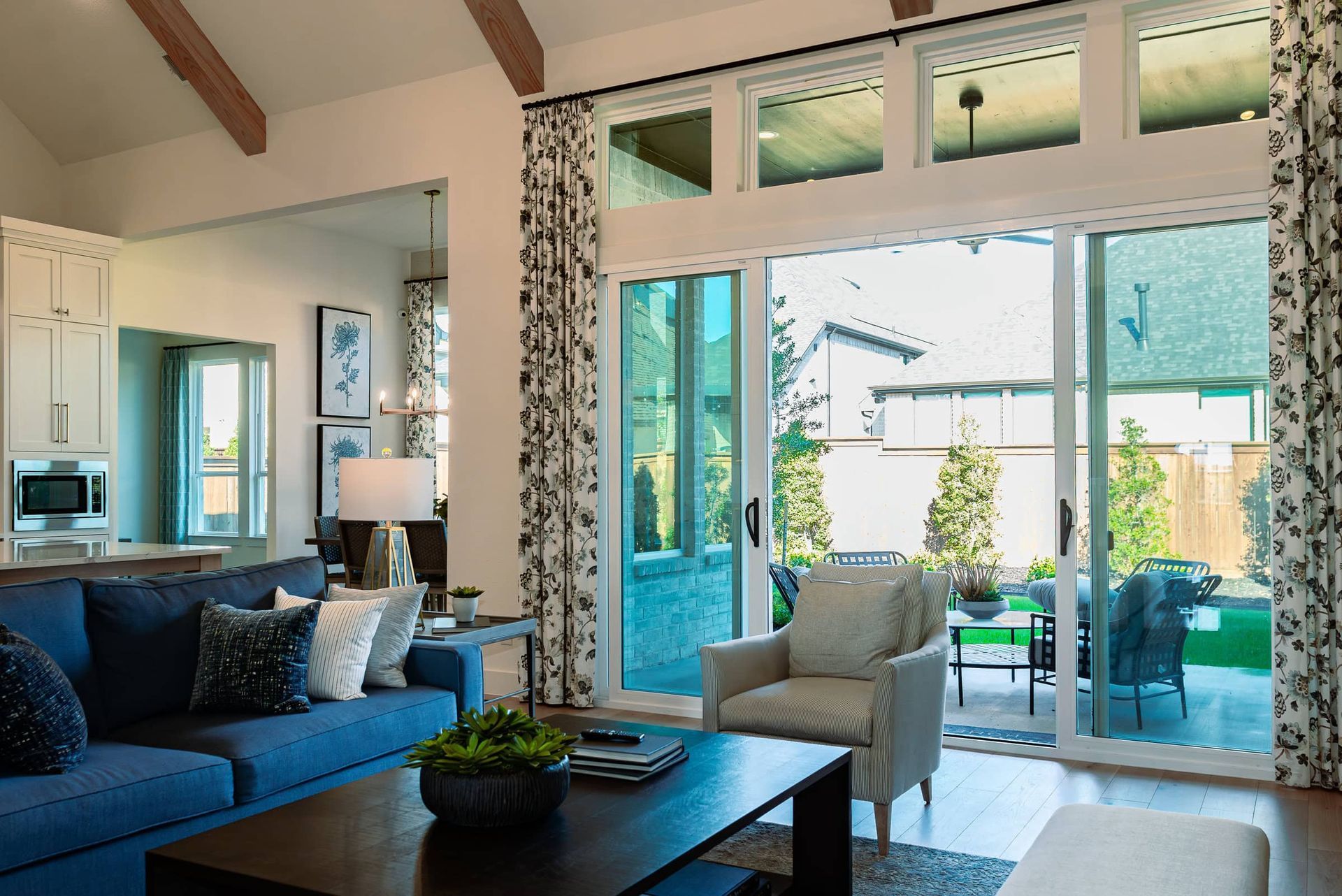 A living room with a blue couch and a coffee table
