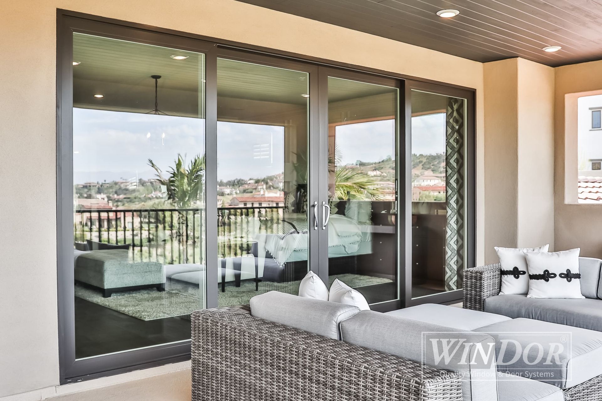 A living room with sliding glass doors and a couch