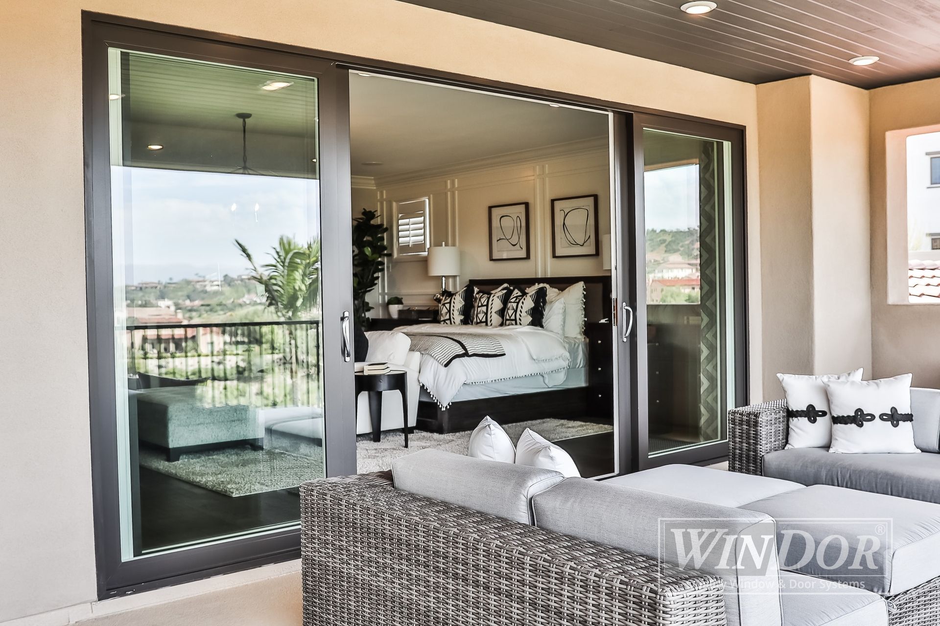 A sliding glass door opens to a bedroom