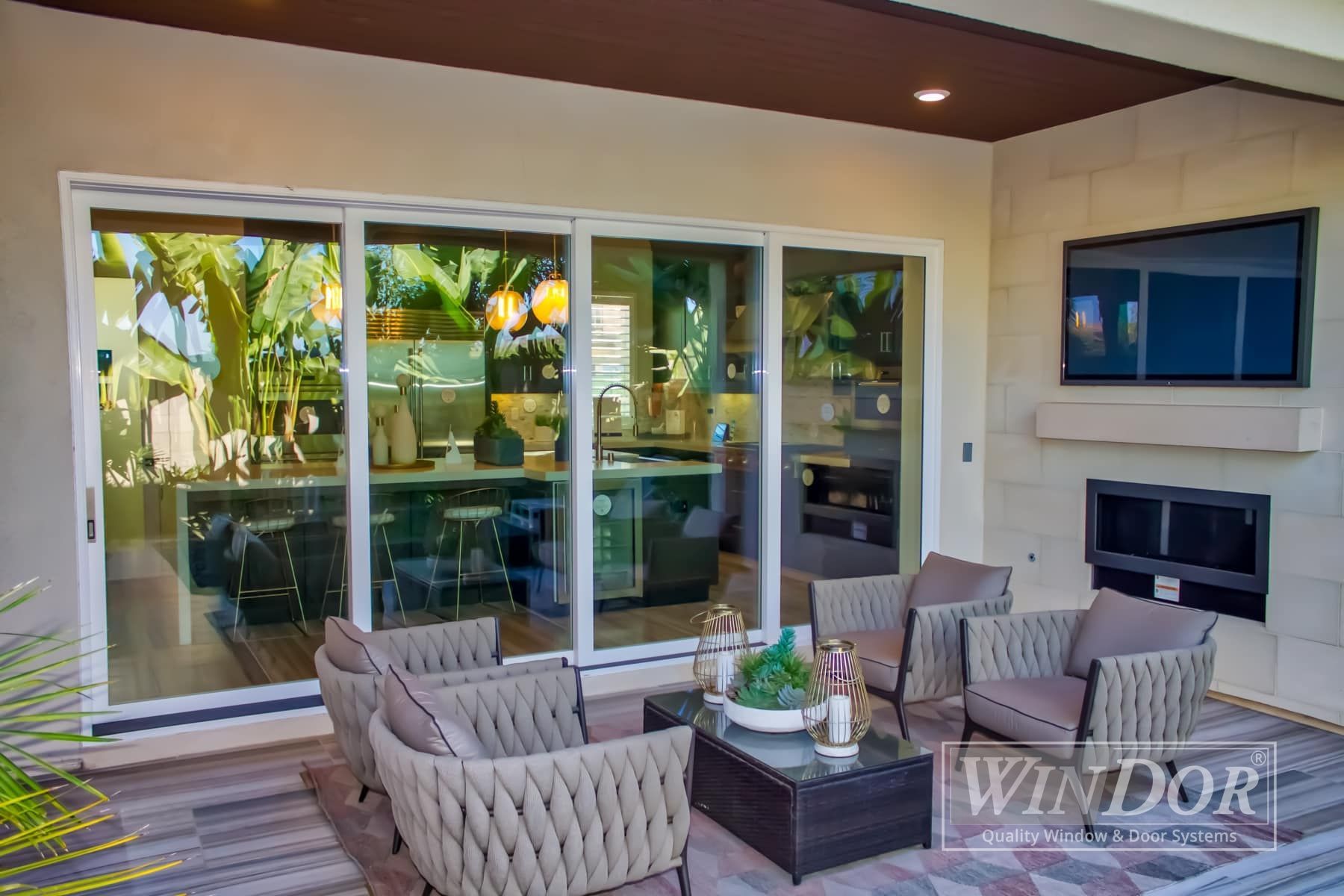 A living room with chairs , a table and a television.