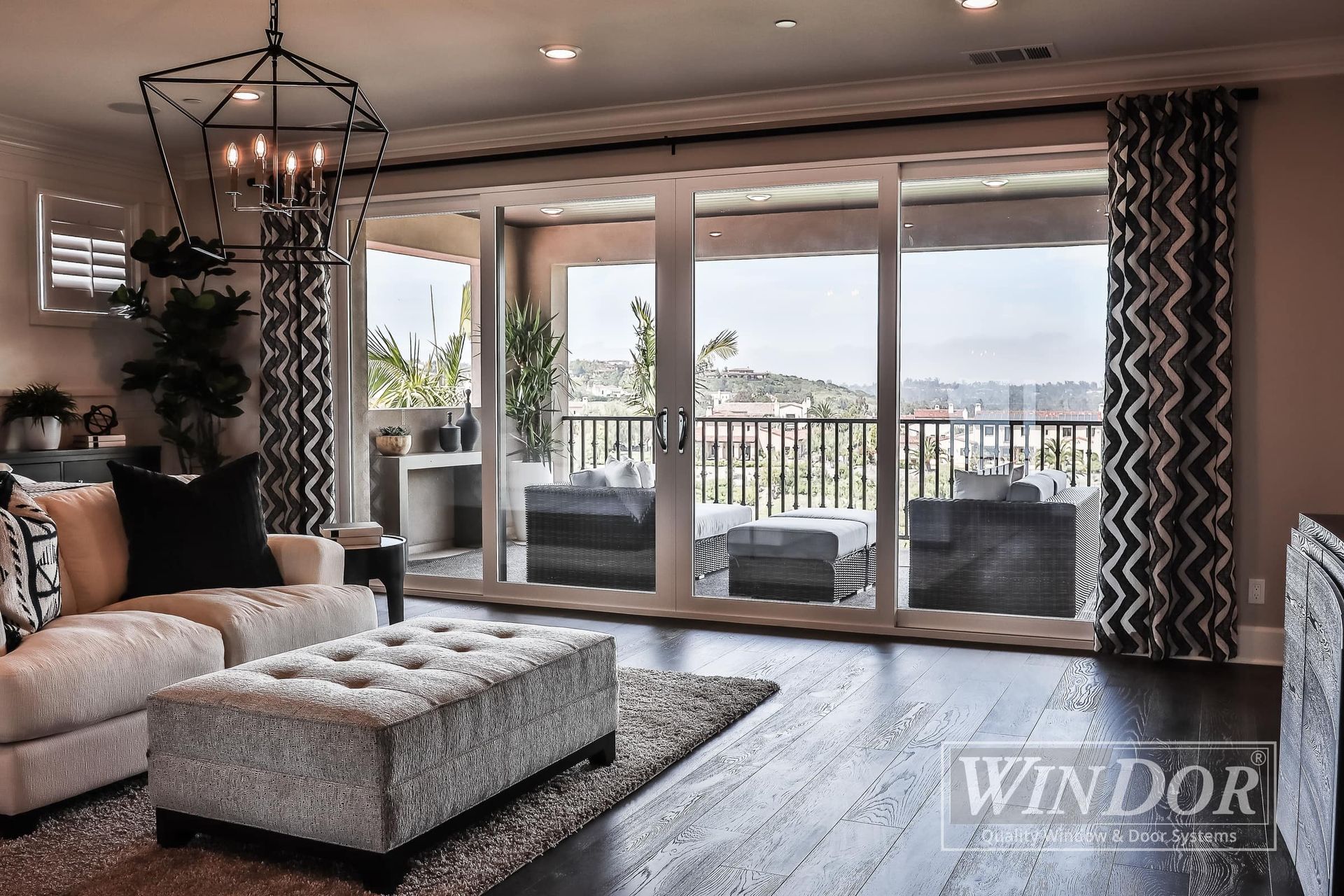 A living room with sliding glass doors leading to a balcony.