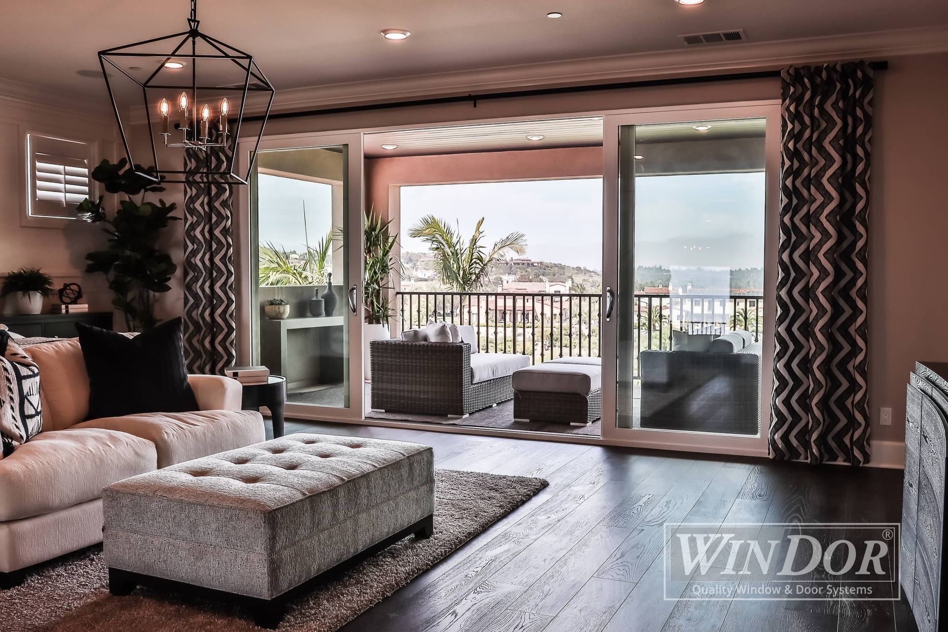 A living room with sliding glass doors and a sign that says windor