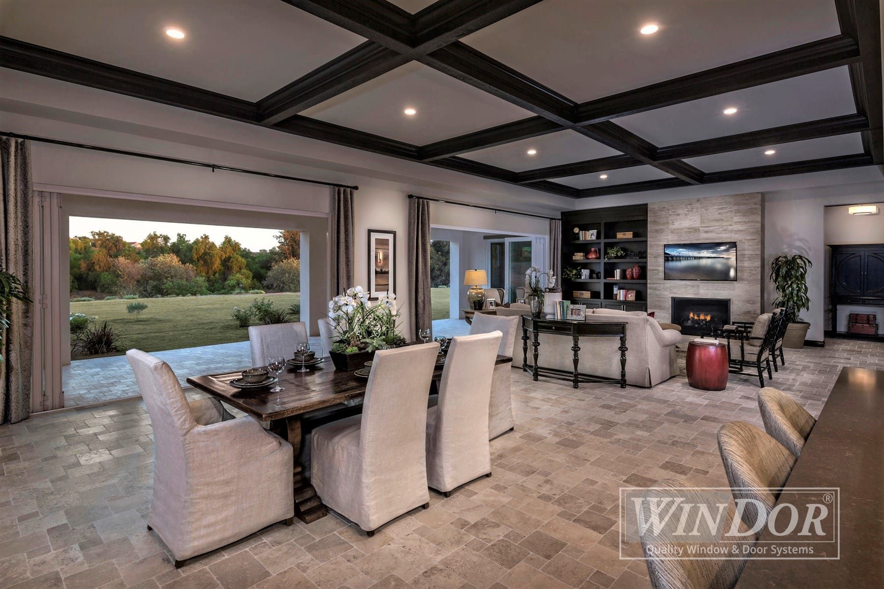 A living room with sliding glass doors that lead to a patio.