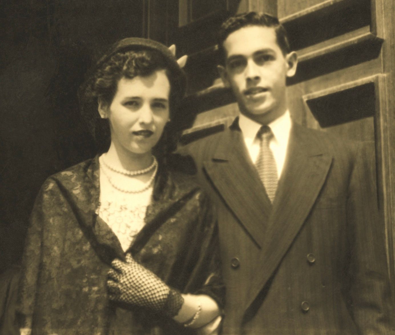 A black and white photo of a man and woman.