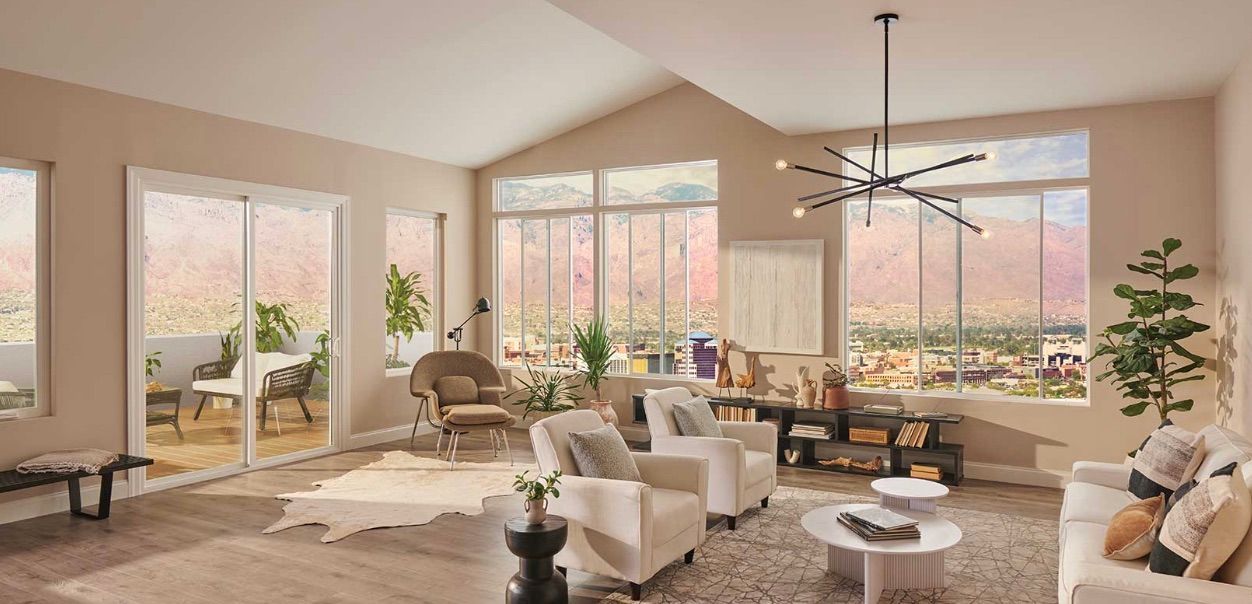 A living room filled with furniture and a ceiling fan.