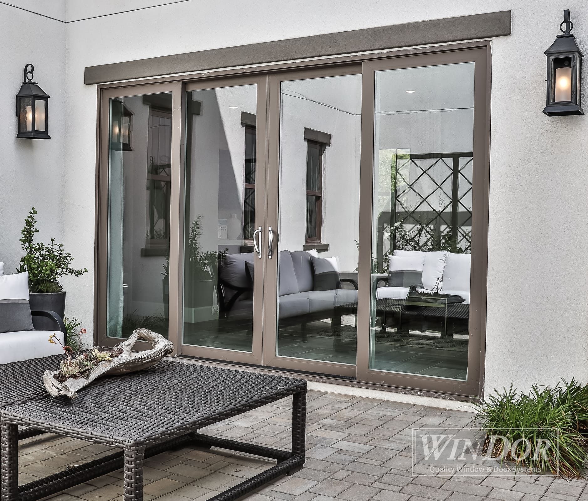 A patio with sliding glass doors leading to a living room