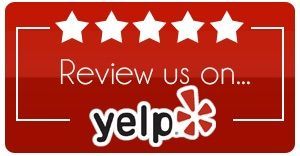 A red sign that says `` review us on yelp ''