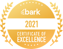 A gold badge that says bark certificate of excellence