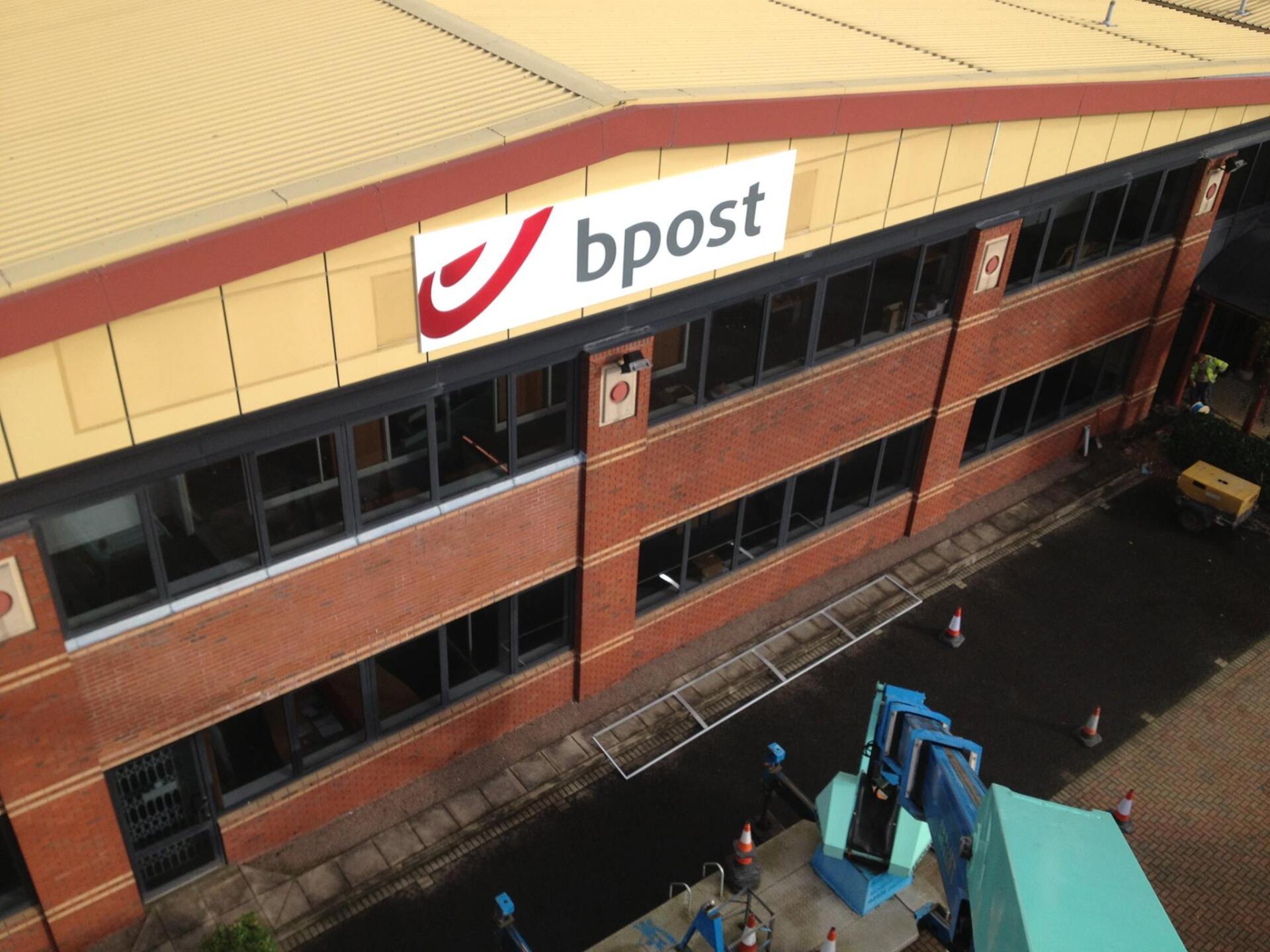 bPost sign on large commercial building