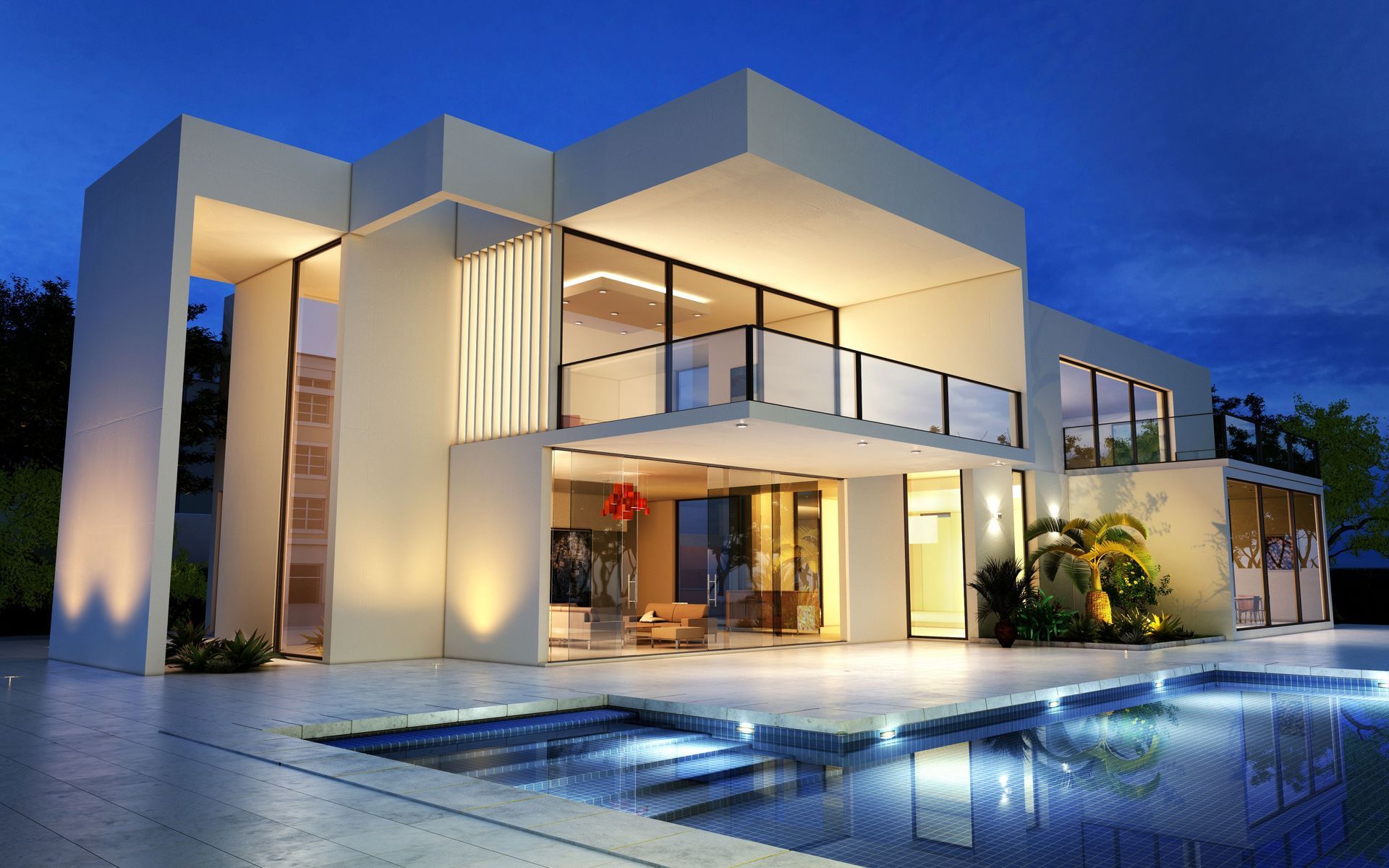 Modern two-story luxury house at dusk with lit windows and a reflecting pool in front