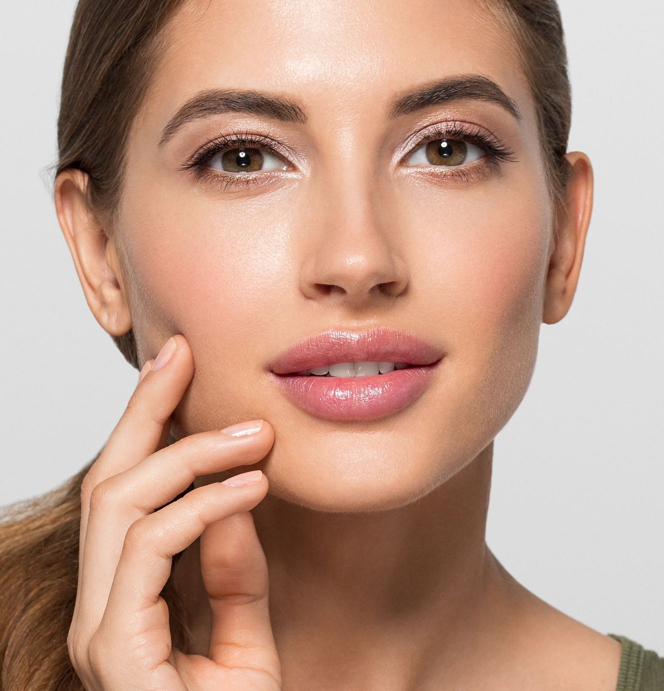 beautiful woman with glowing skin from cosmetic dermatology treatments - clearview dermatology arvada co