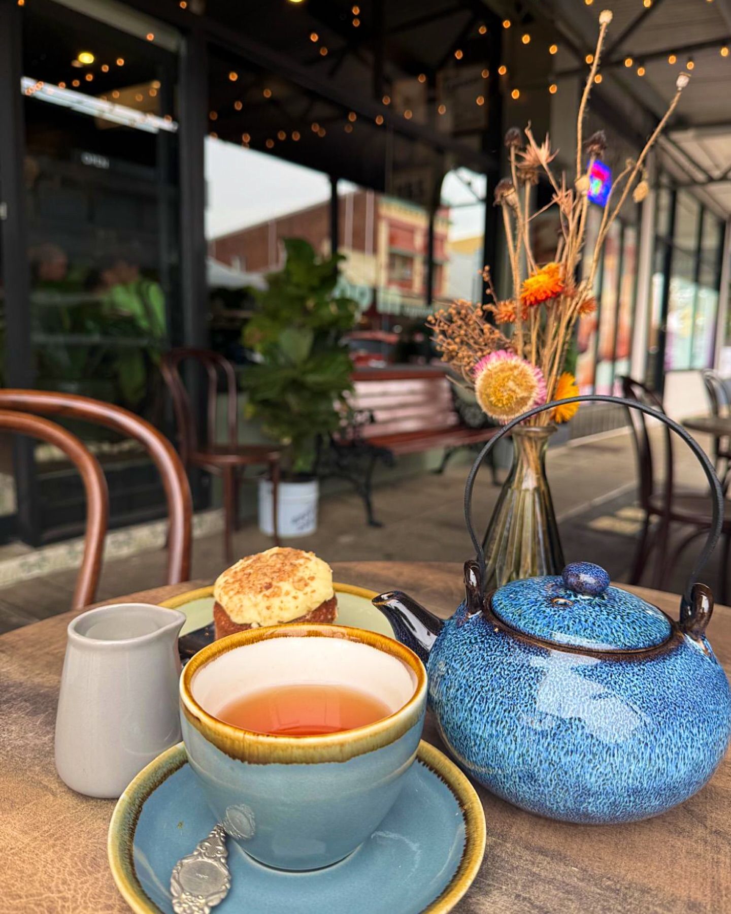 Blue Teapot, Teacup, and Cake on a Cafe Table — Drop In Espresso Bar in Wallsend, NSW