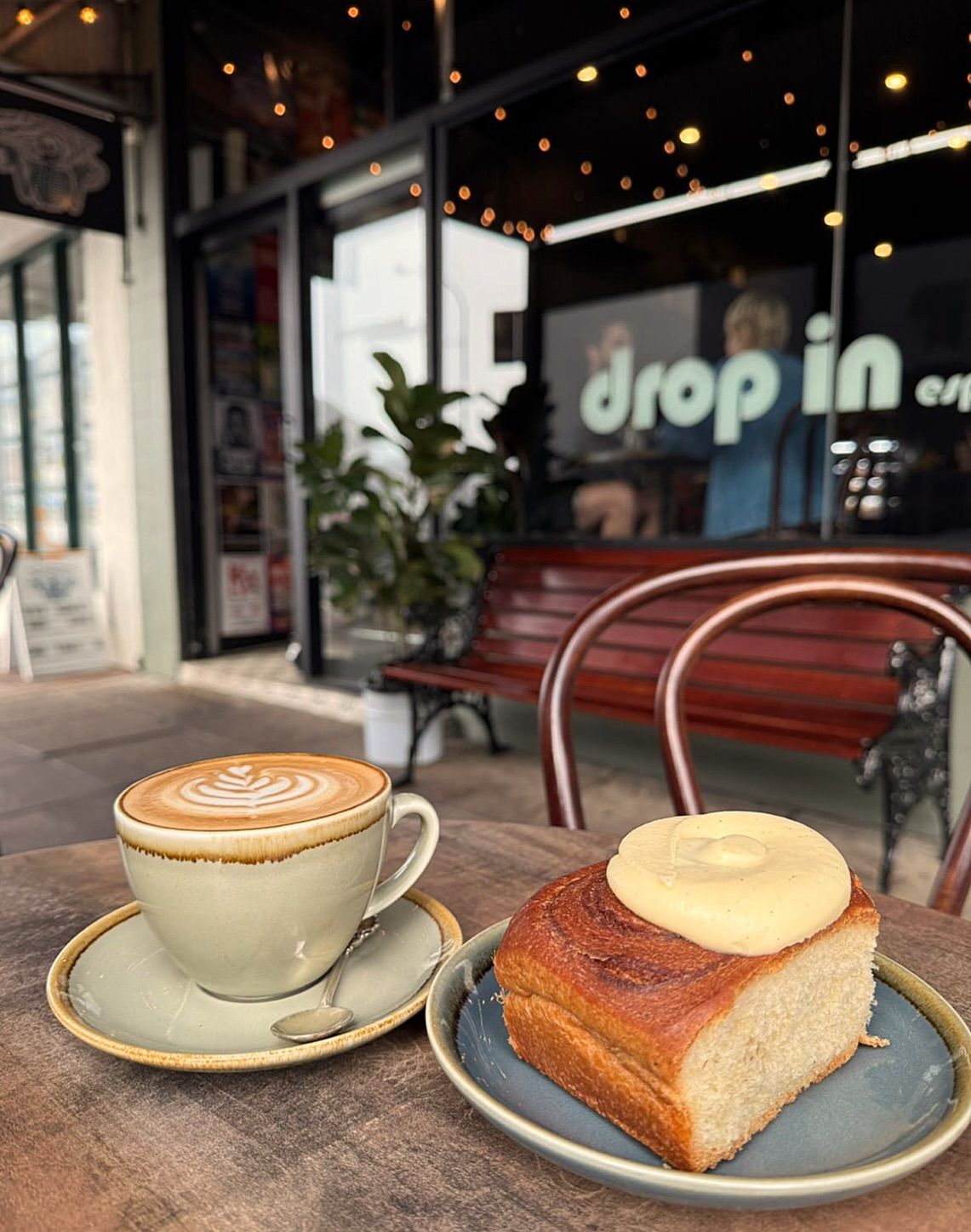 Coffee Cup With Latte Art and Pastry — Drop In Espresso Bar in Wallsend, NSW