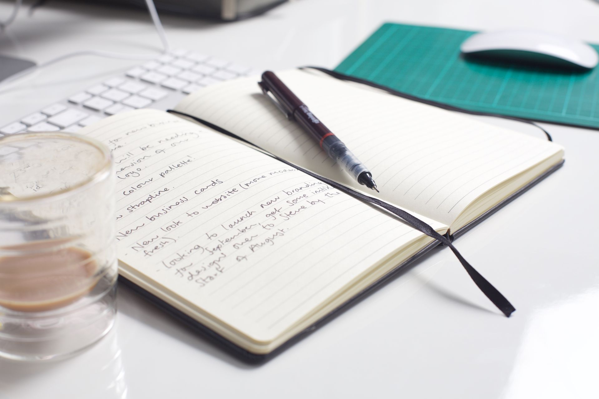 A premium executive notebook, fill out on a white desk