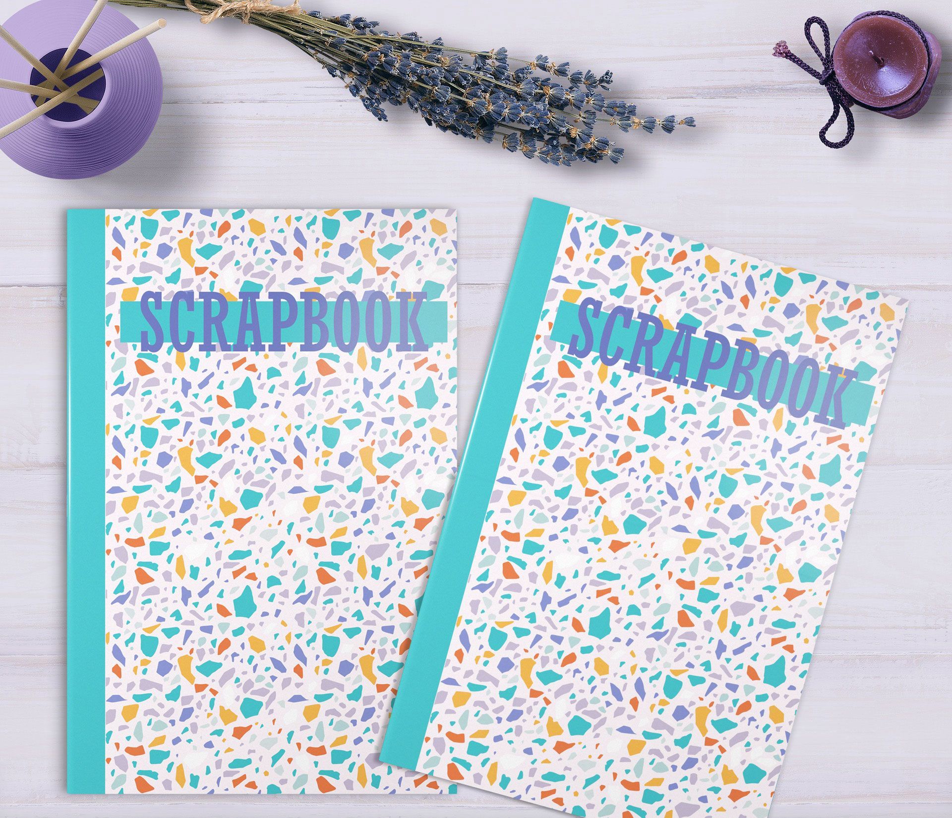 Scrapbooks on desk surrounded by lavender, reed diffuser and candle