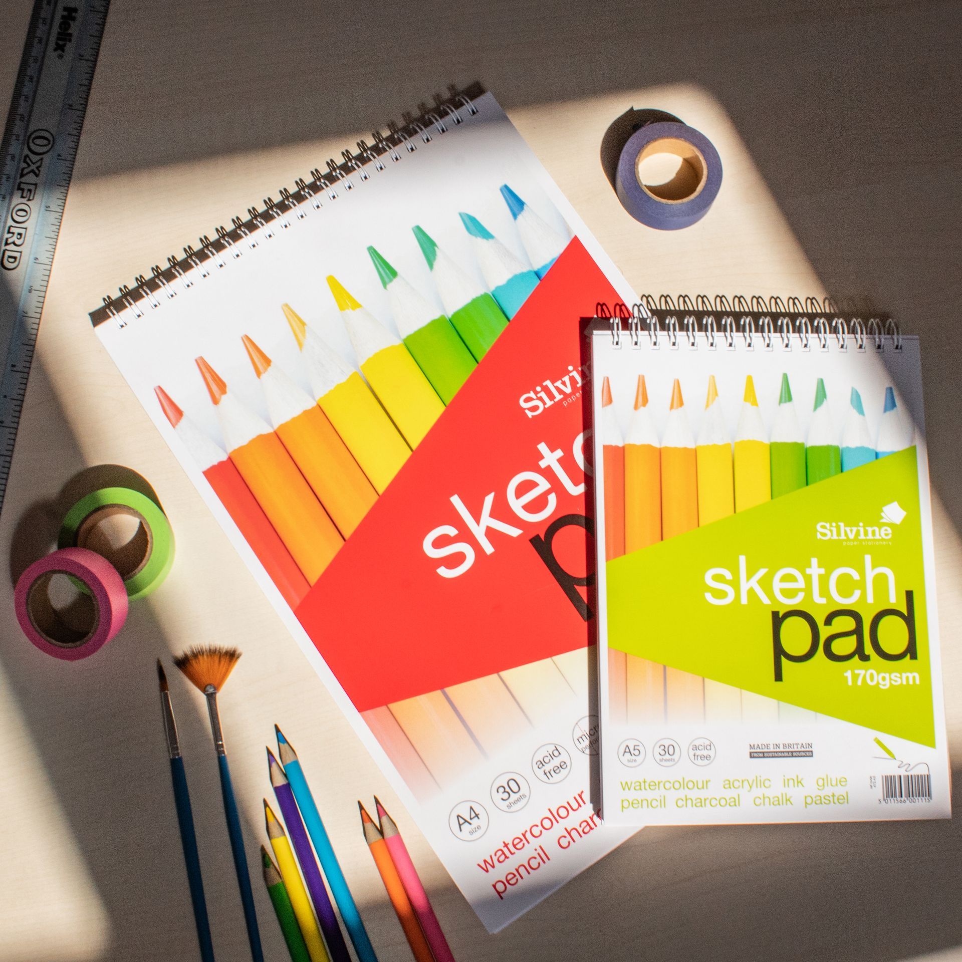 Silvine sketch pads on desk in sun