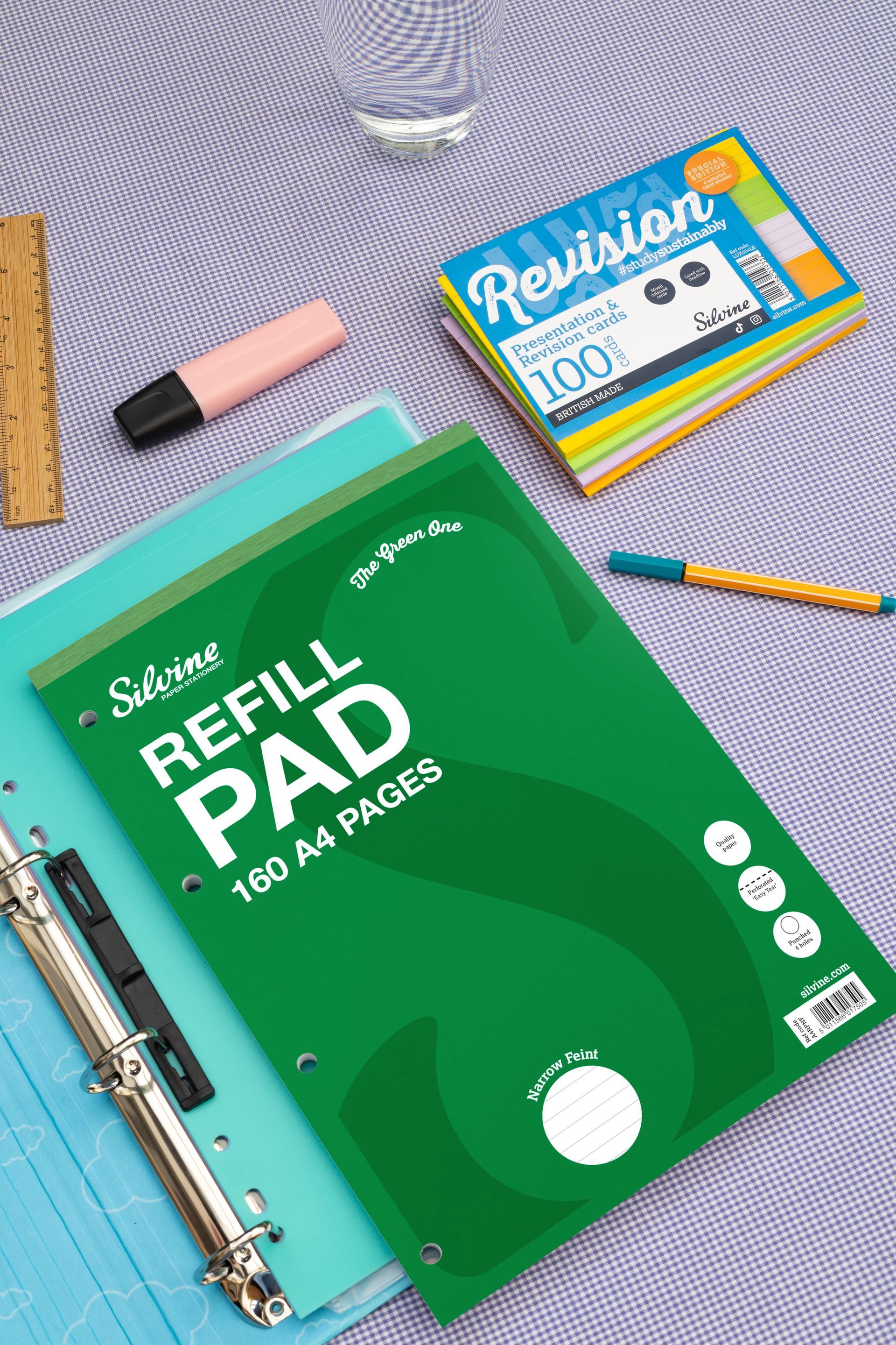 Refill pad. revision cards and desk accessories on a purple background
