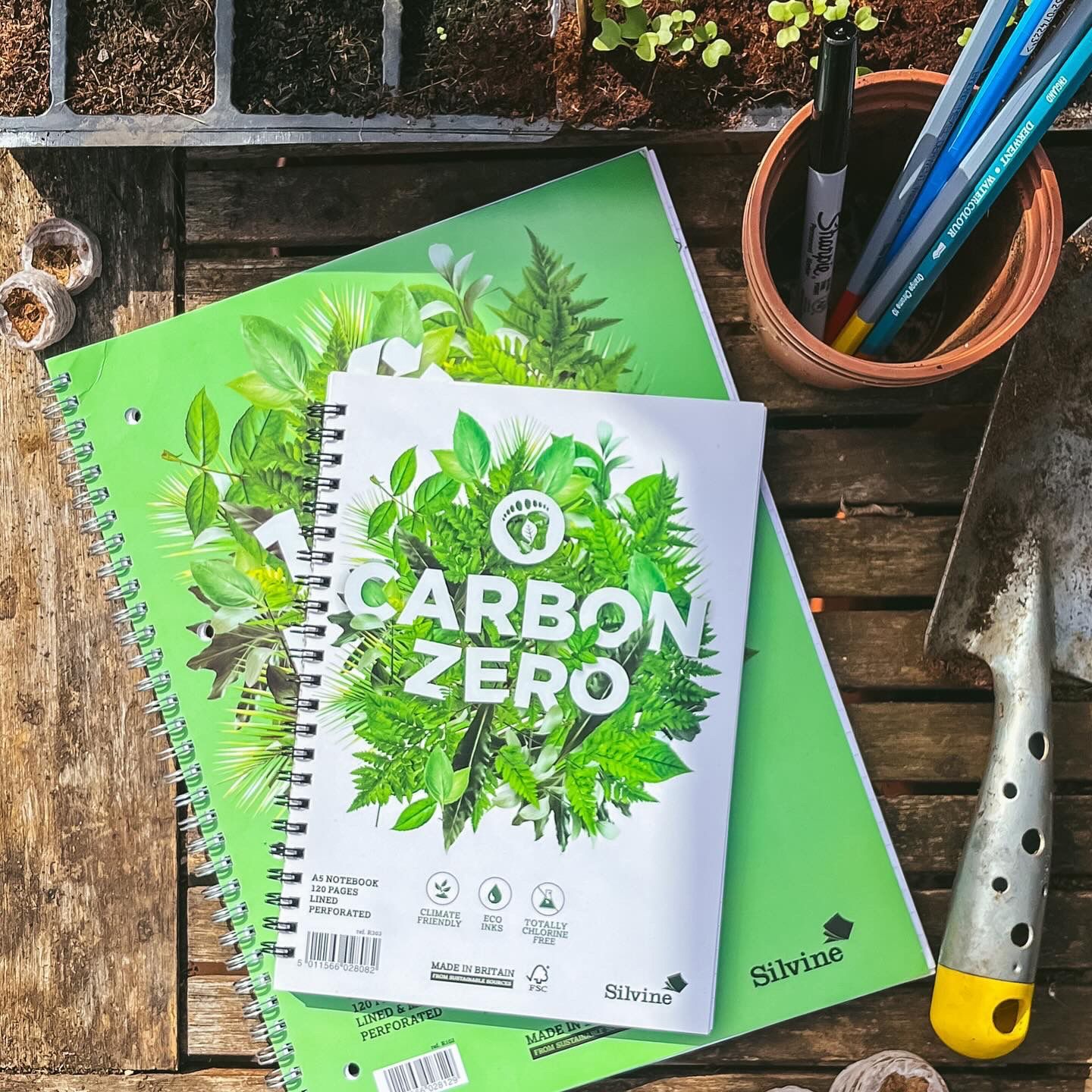 Carbon Zero and 100% Recycled Premium Notebook in outside garden environment.