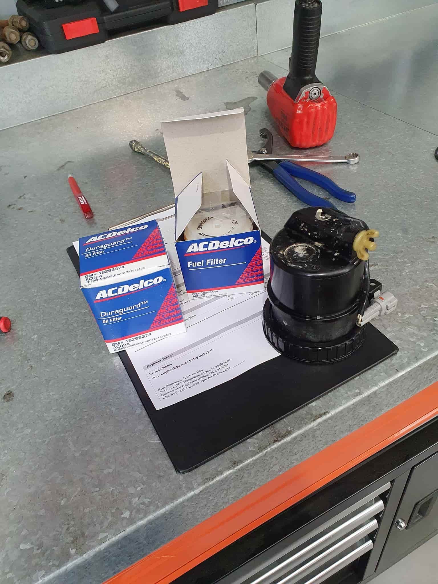 A Box of Acdelco Parts is Sitting on Top of a Metal Table — OSP Automotive & Marine In Grafton, NSW