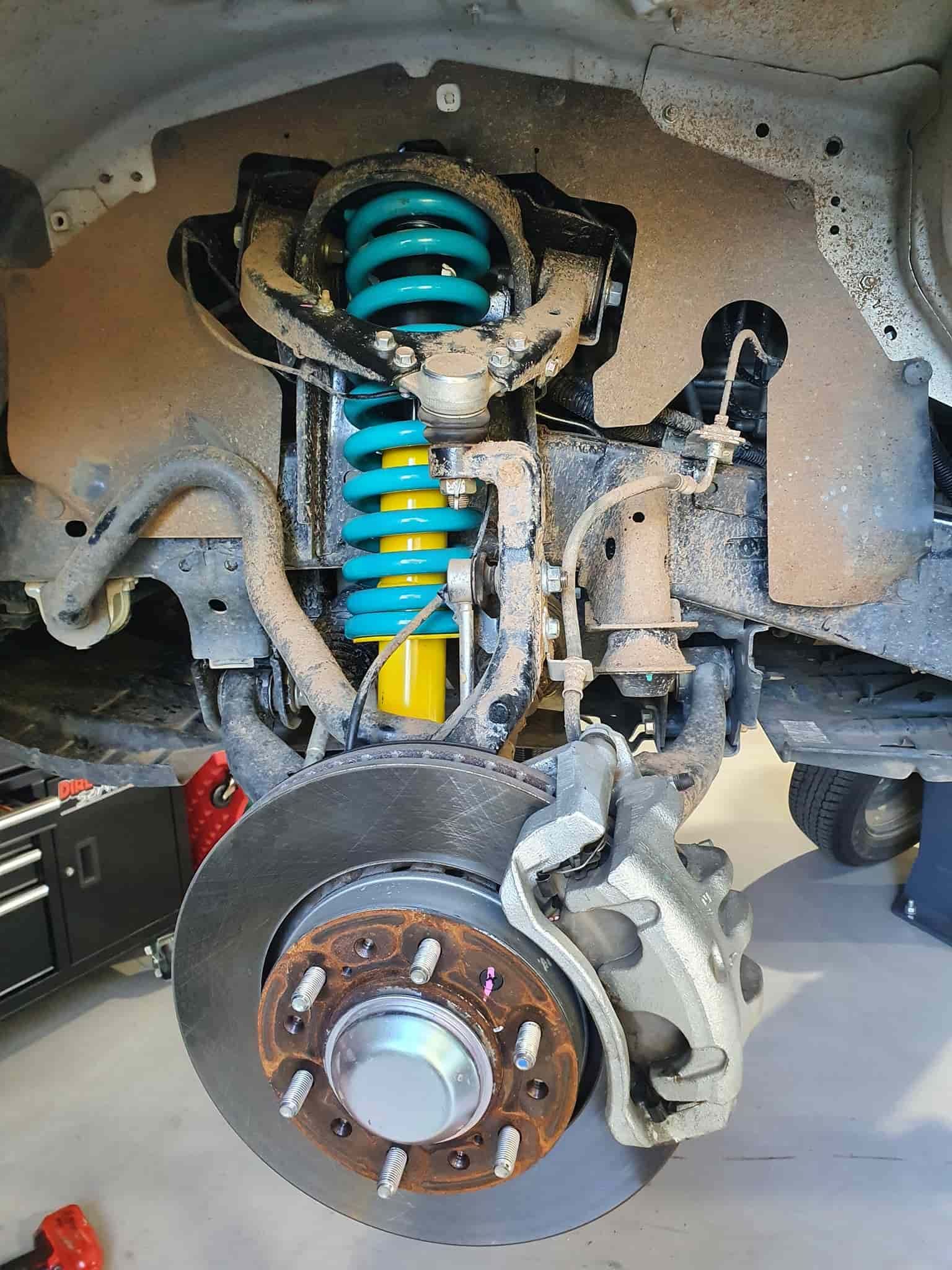 A Close Up of the Underside of a Car With a Suspension and a Brake Disc — OSP Automotive & Marine In Grafton, NSW