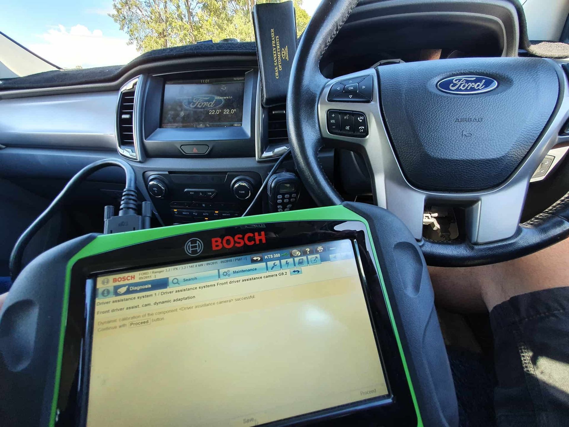 A Person is Using a Bosch Diagnostic Tool in a Car — OSP Automotive & Marine In Grafton, NSW