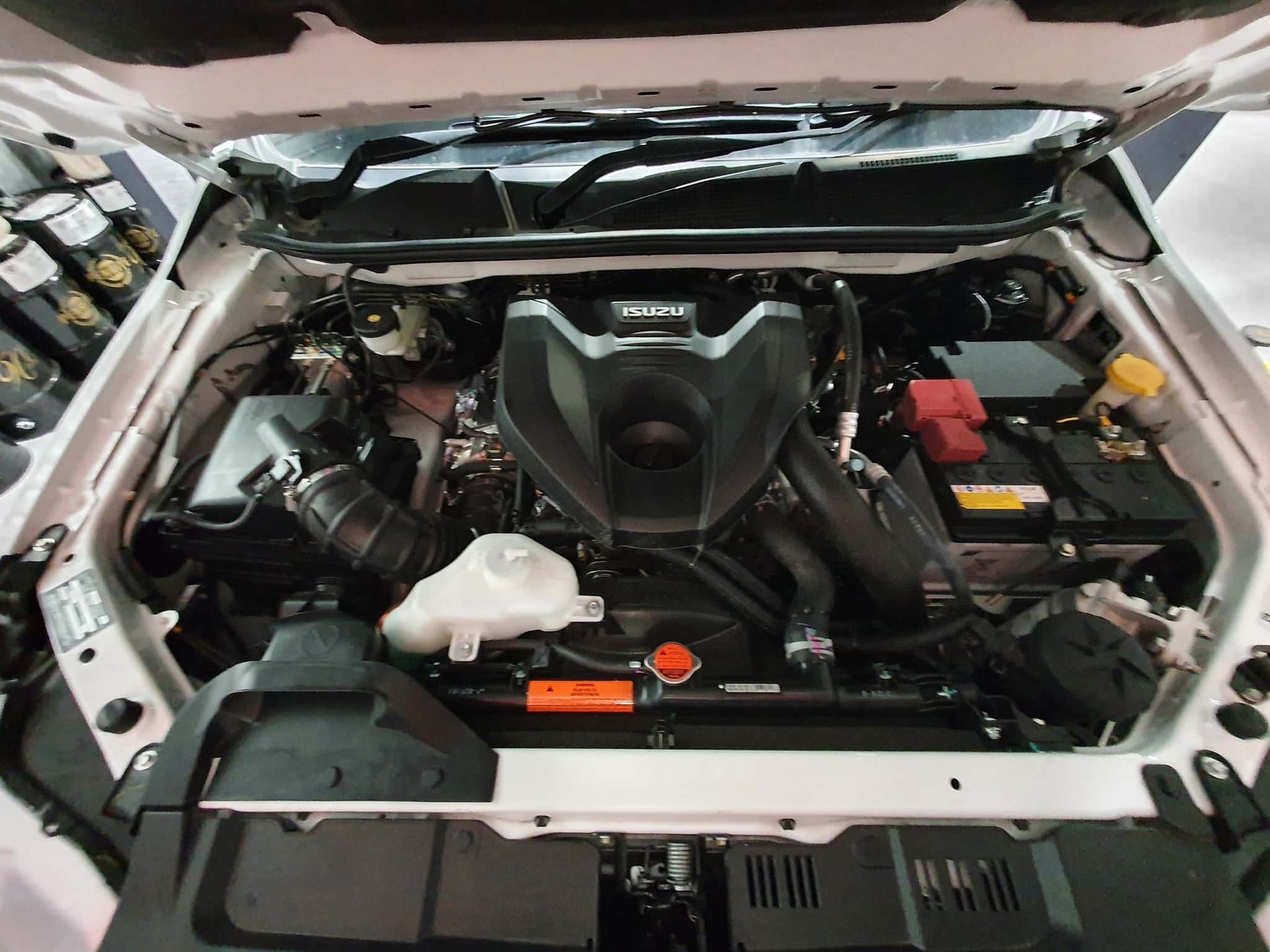 The Engine of a White Car is Shown With the Hood Open — OSP Automotive & Marine In Grafton, NSW