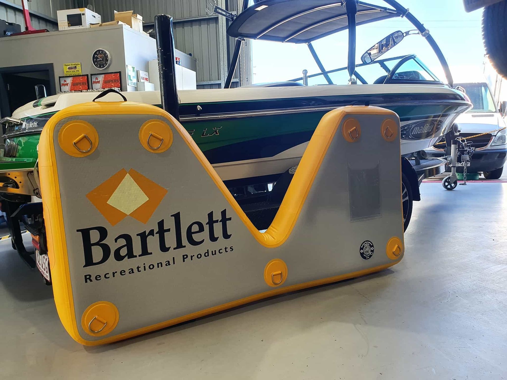 A Boat is Being Towed by a Bartlett Inflatable Platform — OSP Automotive & Marine in Iluka, NSW