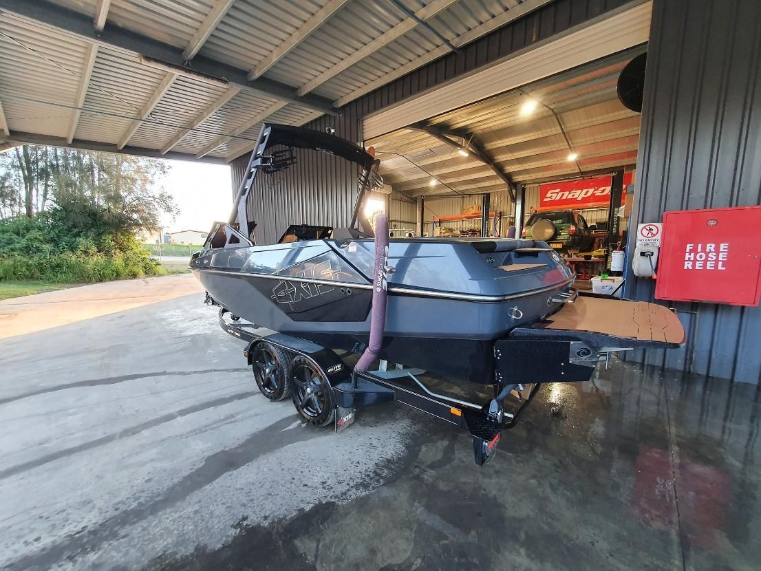 A Boat is Parked Under a Canopy in a Garage — OSP Automotive & Marine In Grafton, NSW