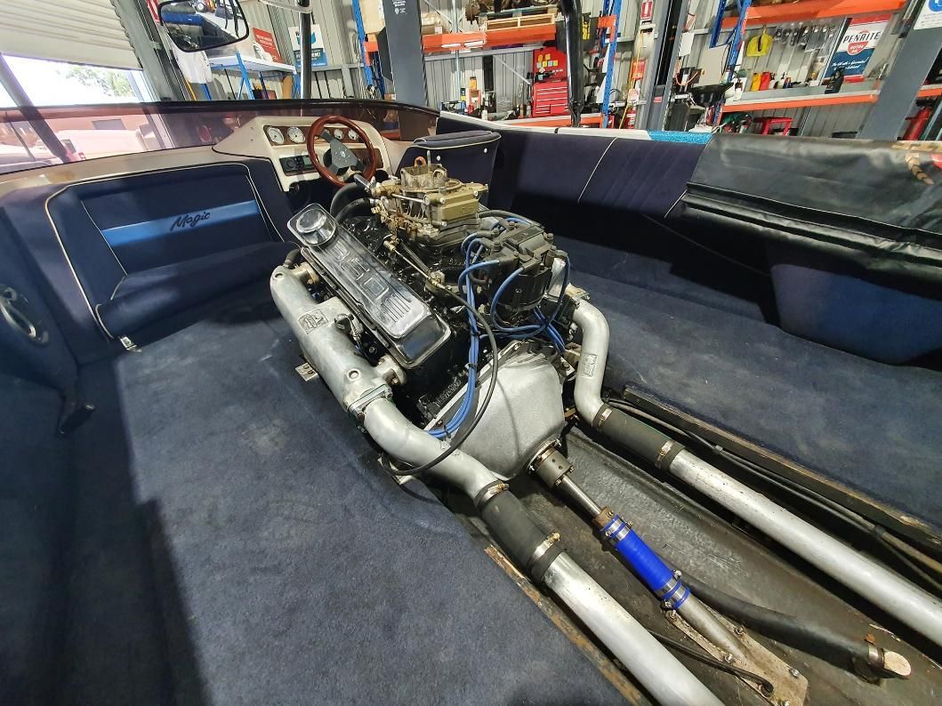 A Large Engine is Sitting in the Back of a Boat — OSP Automotive & Marine In Grafton, NSW