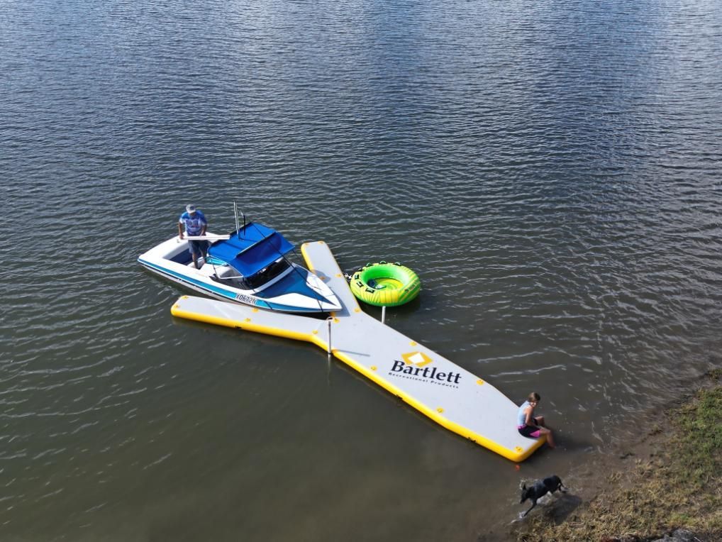 A Boat is Sitting on Top of an Inflatable Dock in the Water — OSP Automotive & Marine In Grafton, NSW