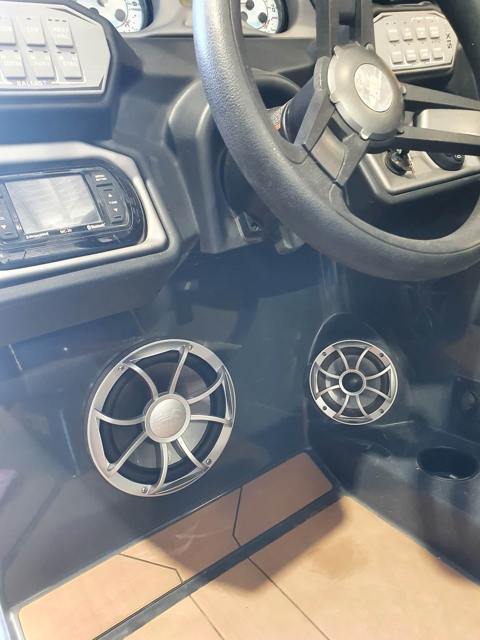 A Close Up of a Boat Dashboard With Speakers and a Steering Wheel — OSP Automotive & Marine In Grafton, NSW