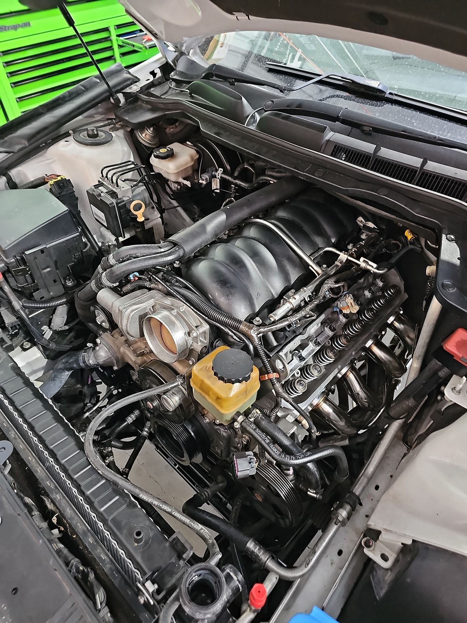 The Engine of a White Car With the Hood Open — OSP Automotive & Marine In Grafton, NSW