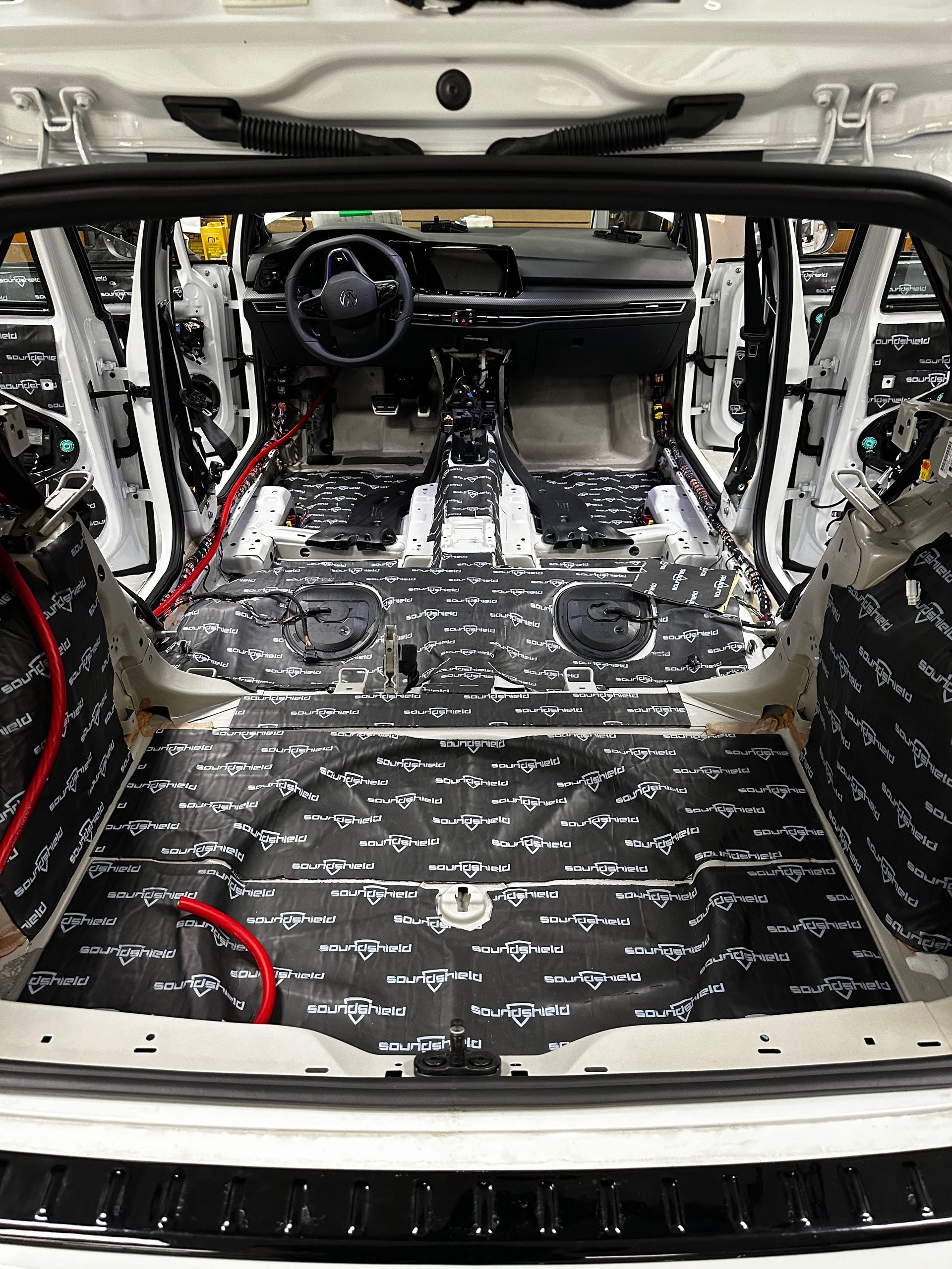 The back of a car with two speakers in it