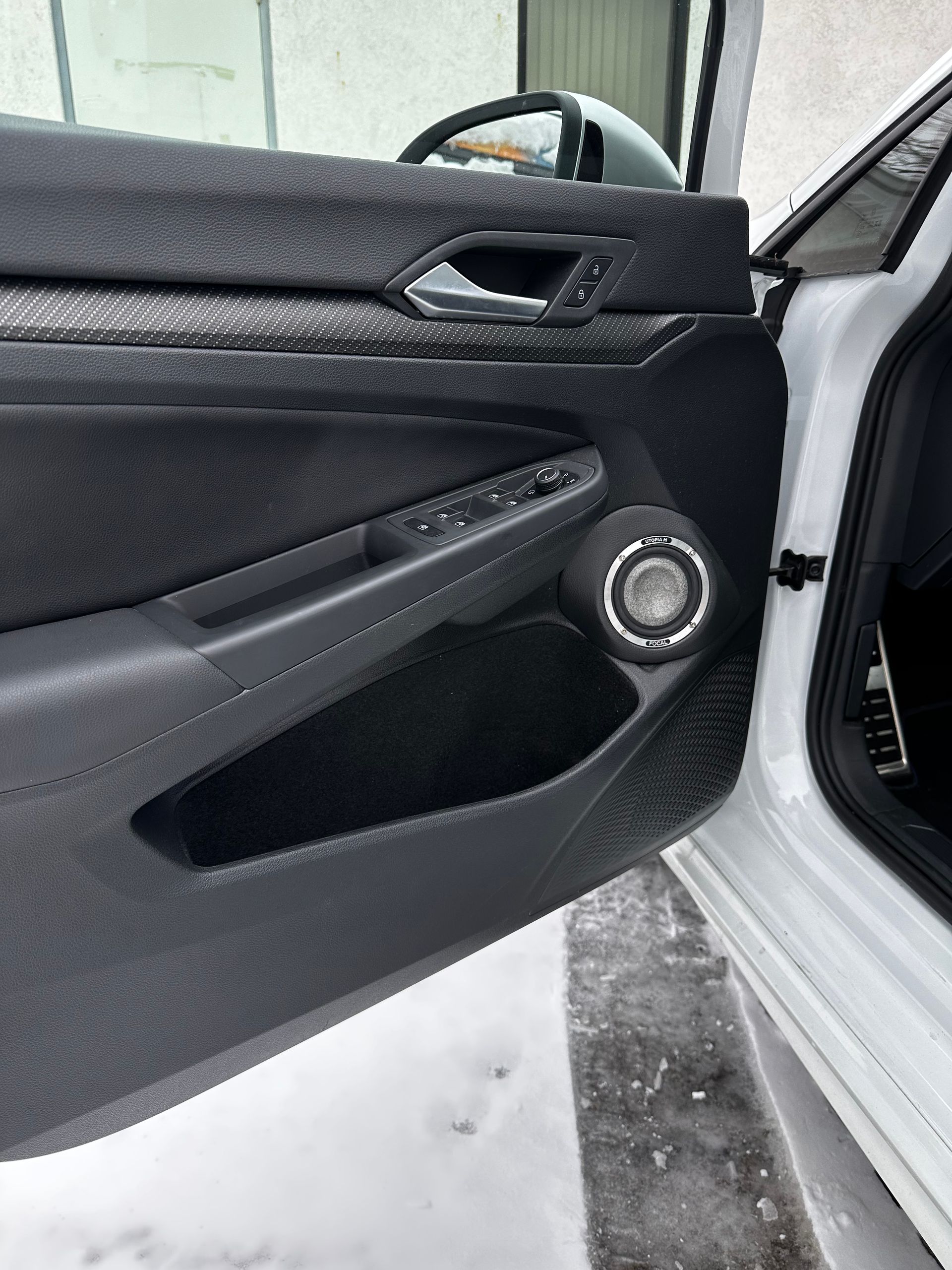 The dashboard of a car with a music player on it