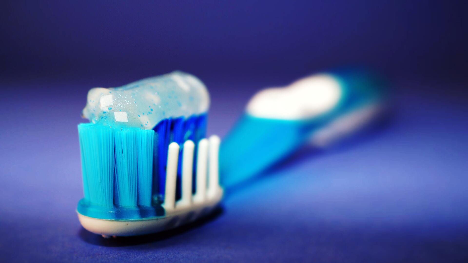 blue toothbrush with crystal toothpaste